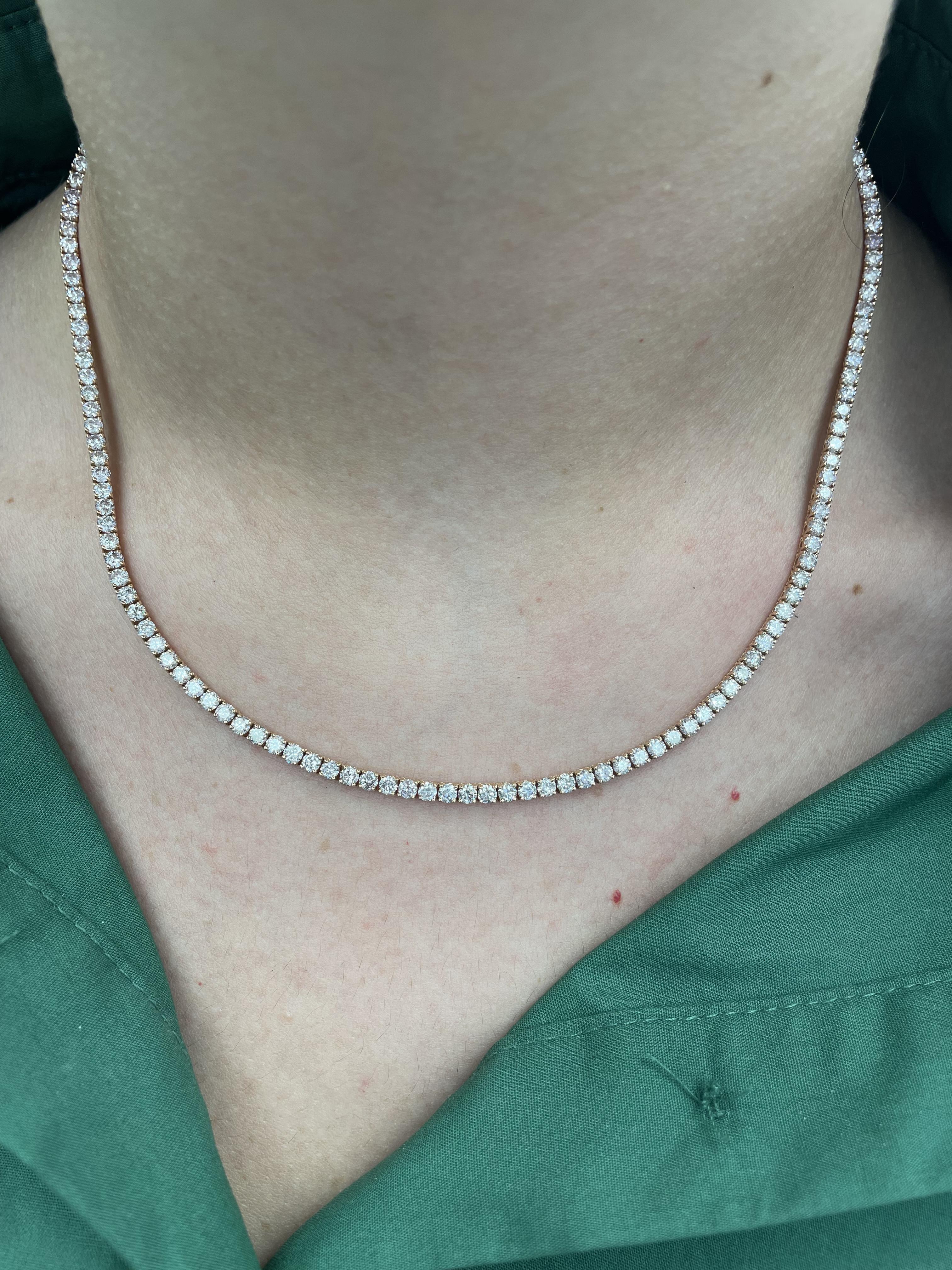 Beautiful and classic diamond tennis necklace, by Alexander Beverly Hills.
150 round brilliant diamonds, 10.22 carats. Approximately G/I color and SI1/SI2 clarity. 14-karat rose gold, 16.92 grams, prong set, 16.5 inches.
Accommodated with an