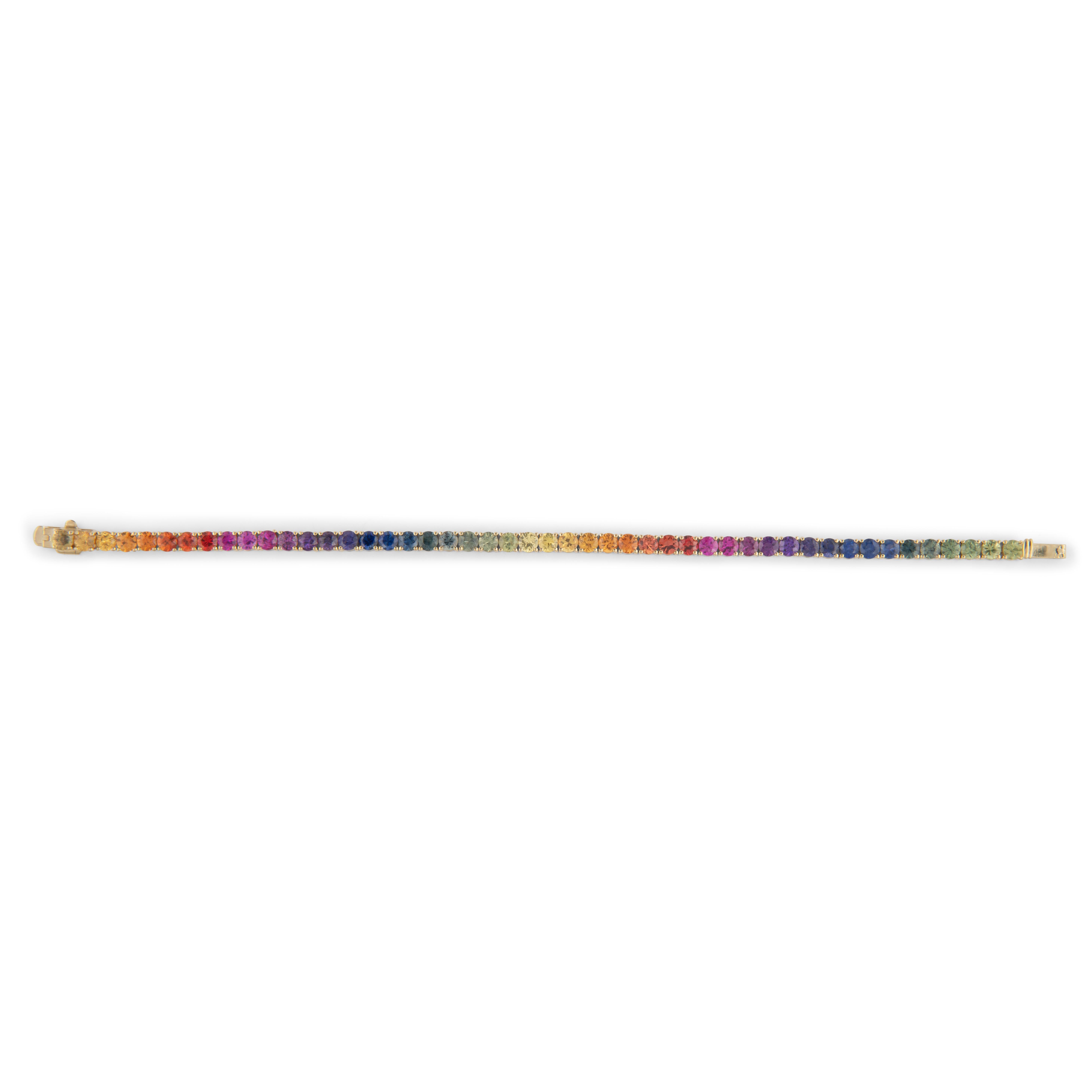 Exquisite and perfectly graduated rainbow multi color sapphire tennis bracelet, by Alexander Beverly Hills.
45 round sapphires, 10.23 carats total. Four prong set in 18k yellow gold, 9.62 grams, 7 inches.
Accommodated with an up-to-date digital