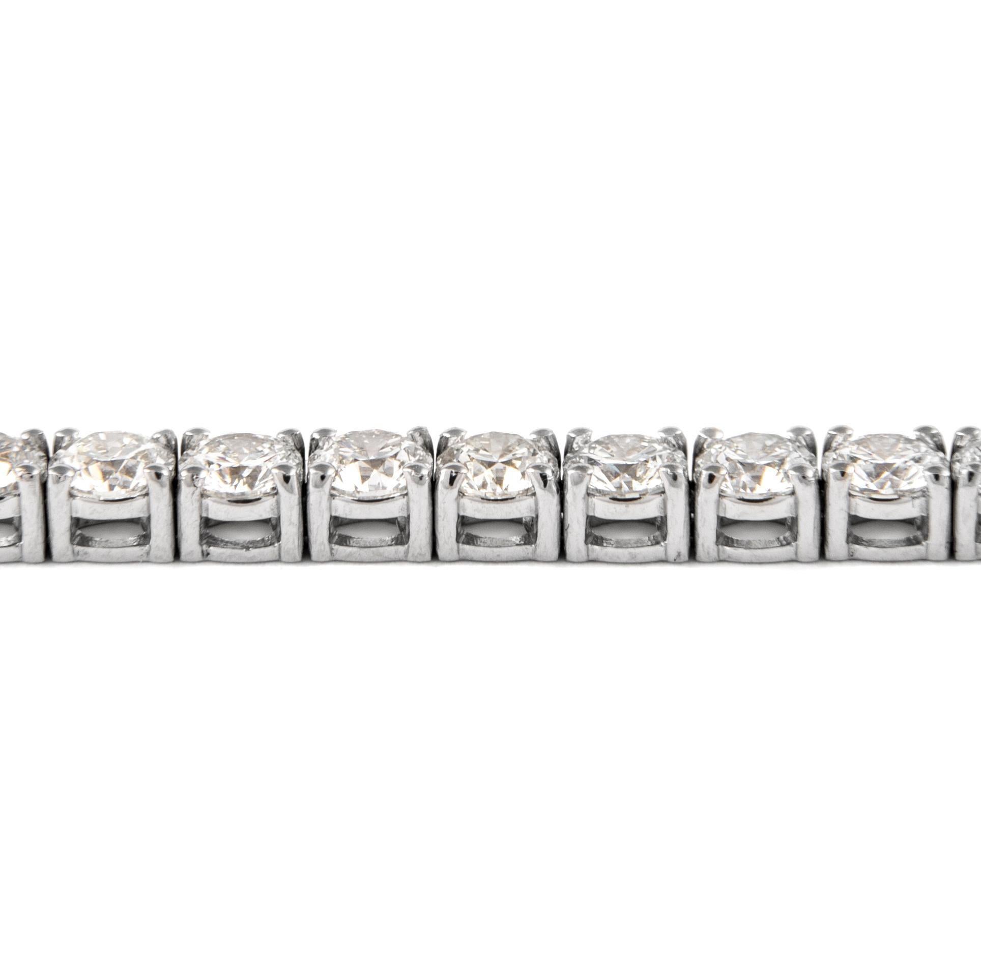 Exquisite and timeless diamonds tennis bracelet, by Alexander Beverly Hills.
44 round brilliant diamonds, 10.34 carats. Approximately G/H color and VS1 clarity. Four prong set in 18k white gold, 13.61 grams, 7 inches. 
Accommodated with an