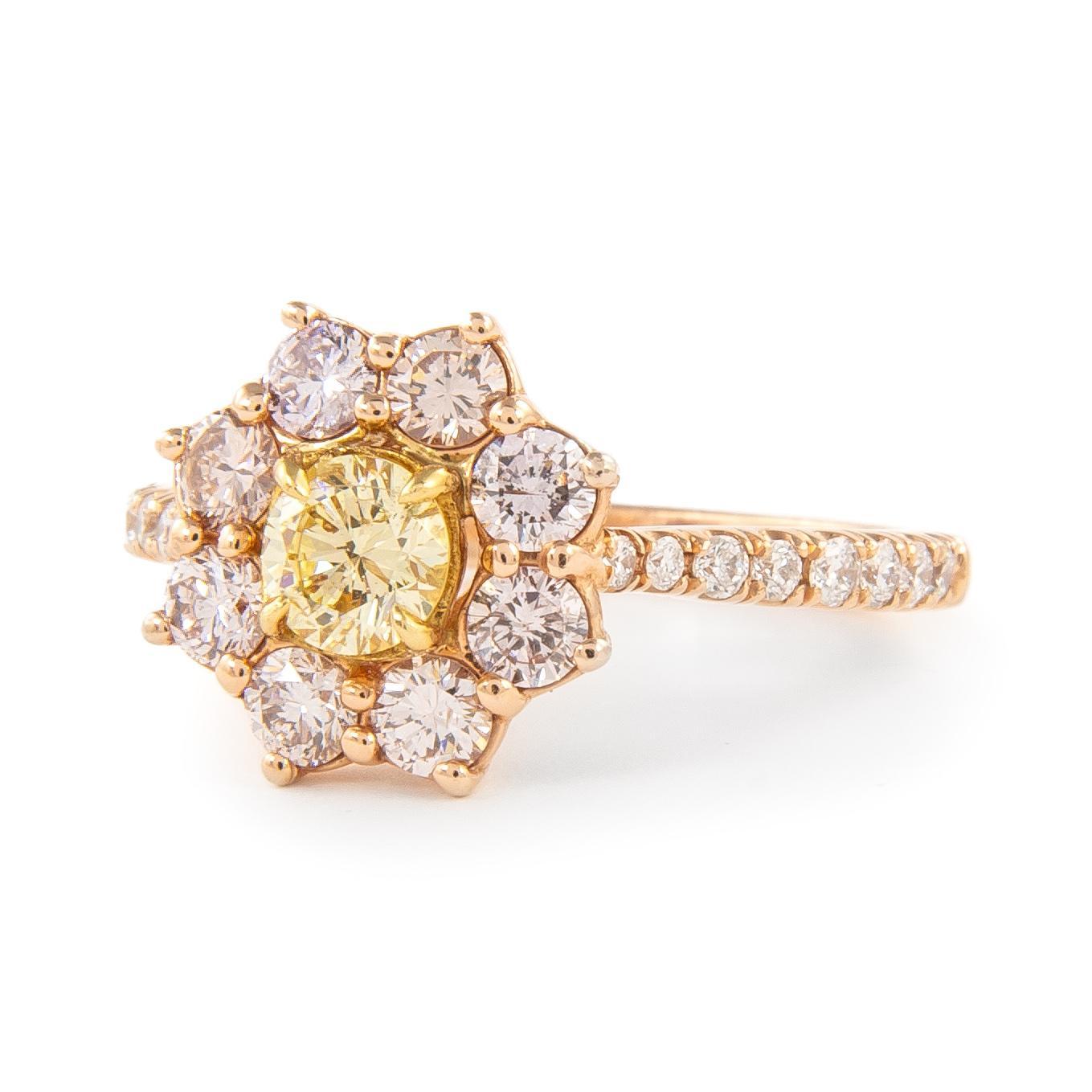 Stunning modern floral natural yellow diamond with pink diamond halo ring. By Alexander Beverly Hills.
1.09 carats total diamond weight.
0.37 carat round brilliant diamond, approximately Light Yellow color and SI1 clarity. 8 round brilliant