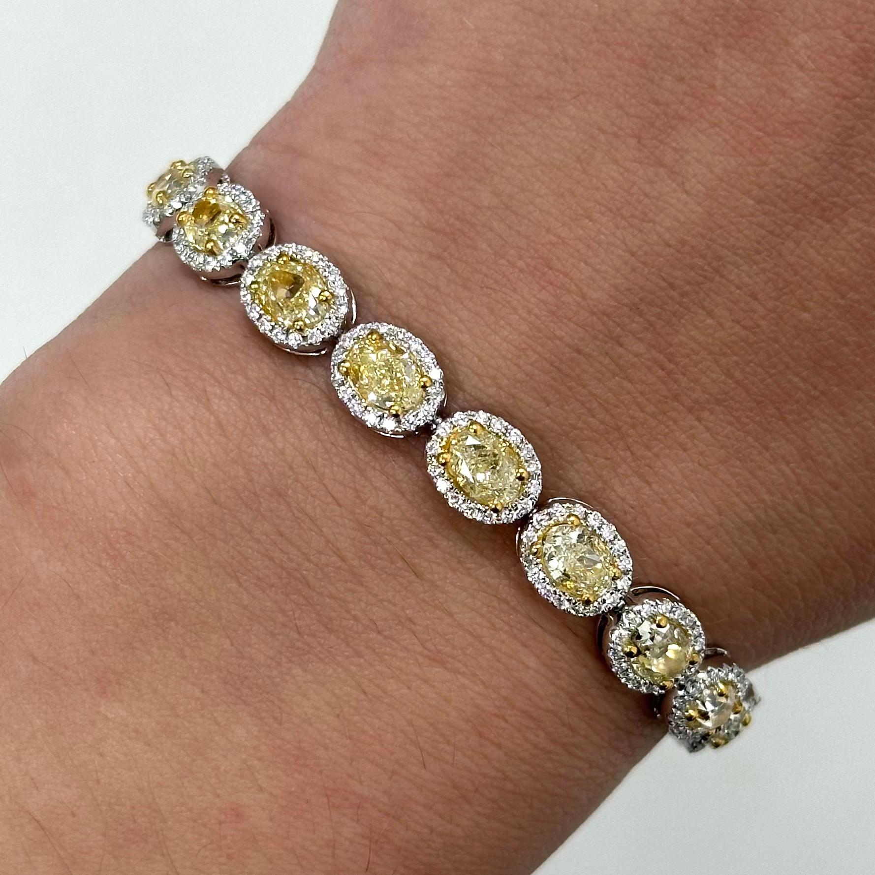 Stunning yellow oval diamond bracelet in 18k two tone gold, high jewelry by Alexander Beverly Hills.
11.14 carats total diamond weight.
22 oval diamonds, 9.81 carats. Approximately Fancy/Fancy Light Yellow color and VS clarity. Complimented by 352