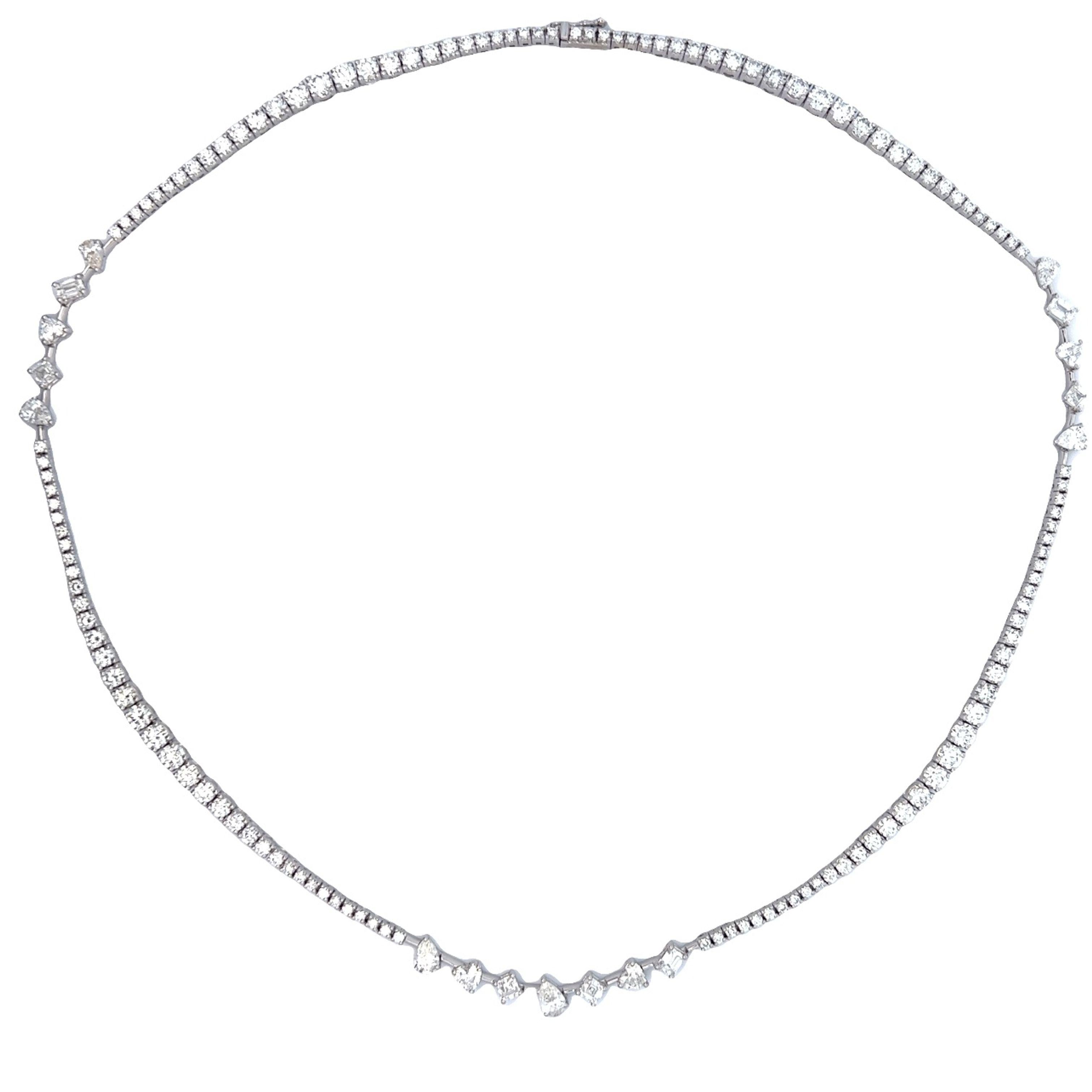 Beautiful diamond tennis necklace with multi diamond layout, by Alexander Beverly Hills.
11.41 carats total diamond weight.
131 round brilliant diamonds, 7.92 carats. Approximately F/G color and VS clarity. 6 pear shape diamonds, 1.35 carats.