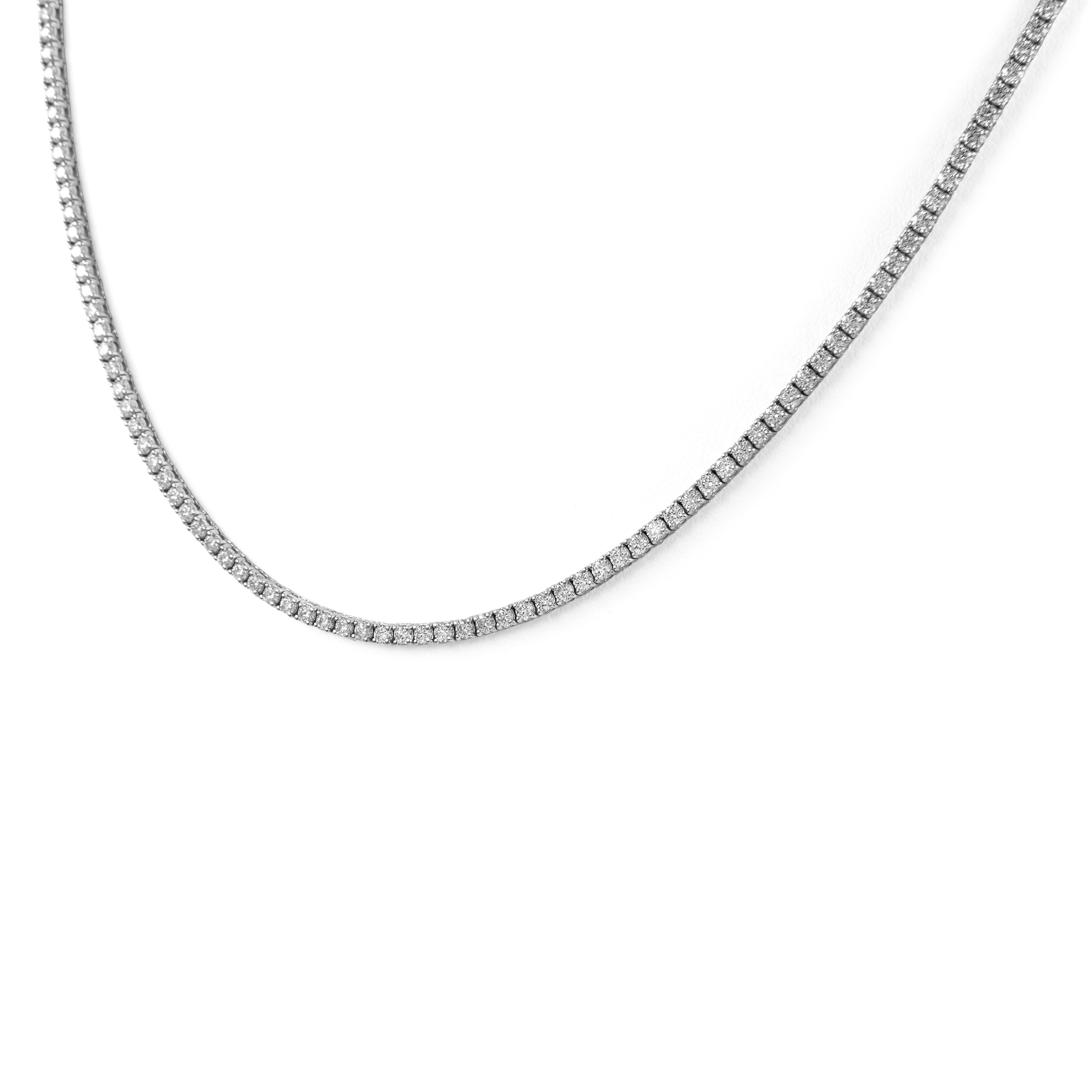Beautiful and classic diamond tennis riviera necklace, by Alexander Beverly Hills.
219 round brilliant diamonds, 11.66ct. Approximately F/G color and VVS2/VS1 clarity. 14k white gold, 24.15 grams, 24in.
Accommodated with an up-to-date digital