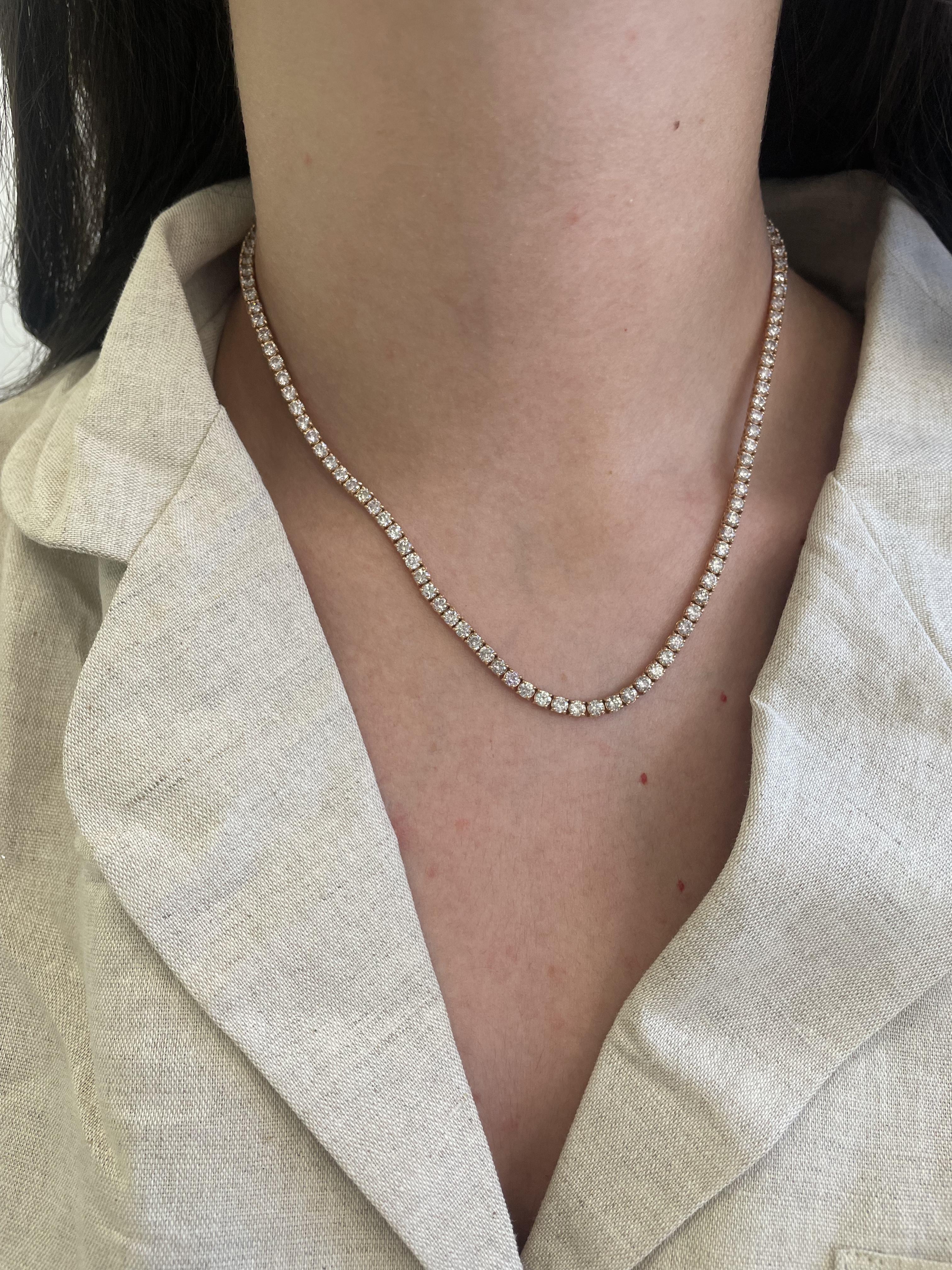 Beautiful and classic diamond tennis necklace, by Alexander Beverly Hills.
118 round brilliant diamonds, 11.75 carats. Approximately G/I color and SI1 clarity. 14-karat rose gold, 19.90 grams, prong set, 16.5 inches.
Accommodated with an up-to-date