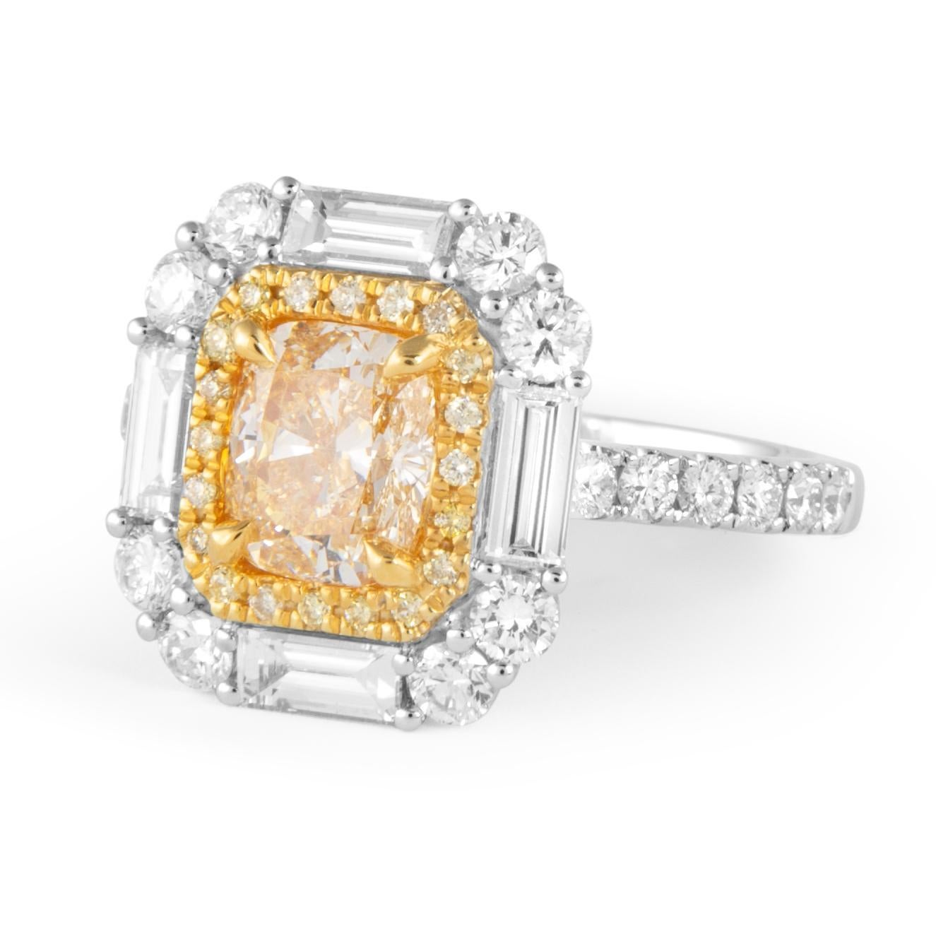 Stunning modern EGL certified natural fancy yellow diamond with yellow diamond double halo ring with baguette halo, two-tone 18k white and yellow gold.
High jewelry by Alexander Beverly Hills.
2.34 carats total diamond weight.
1.20 carat cushion