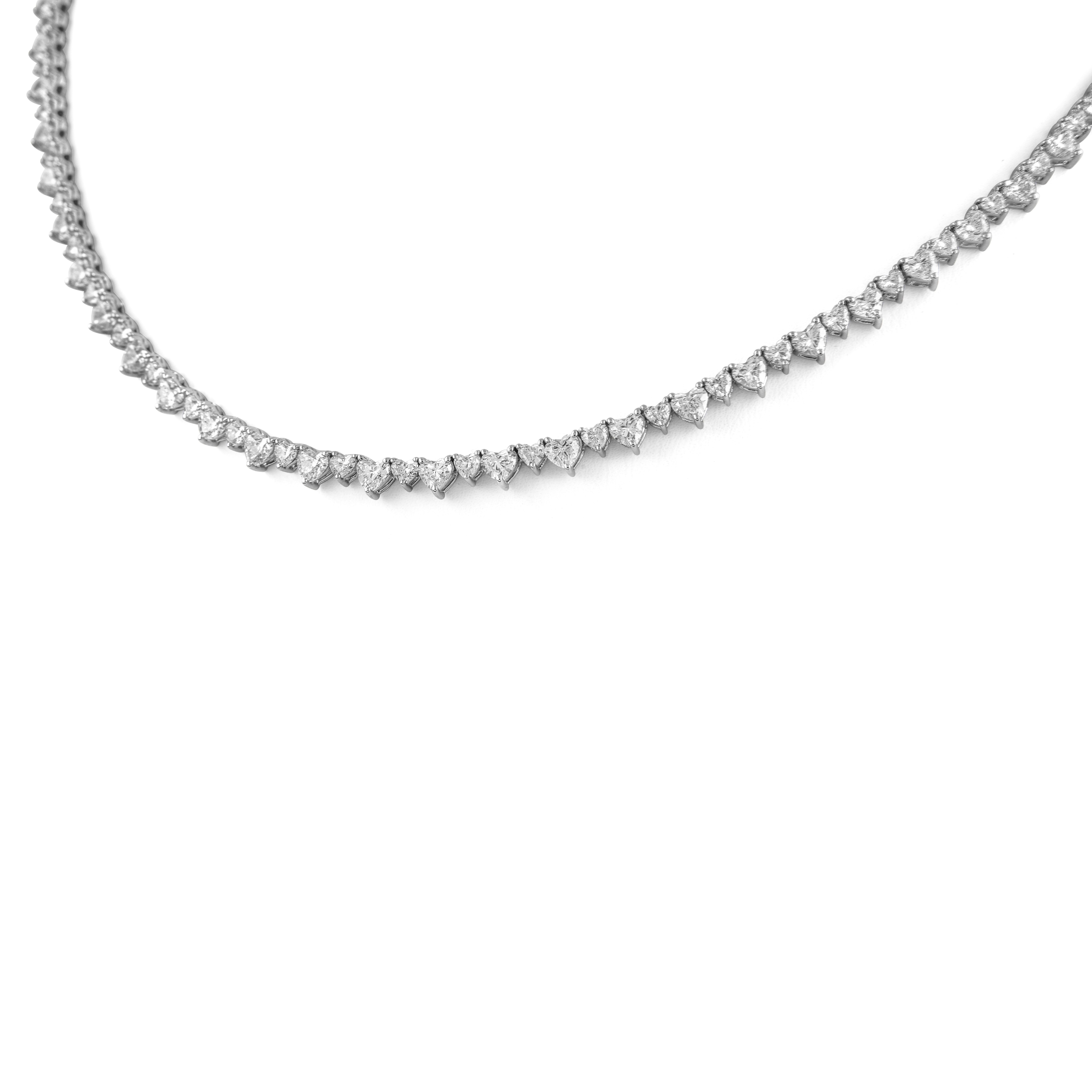 Beautiful and modern alternating heart diamond necklace. High jewelry by Alexander Beverly Hills.
12.24 carats total diamond weight.
35 heart brilliant diamonds, 5.09 carats. 58 heart brilliant diamonds, 5.27 carats. 34 heart brilliant diamonds,