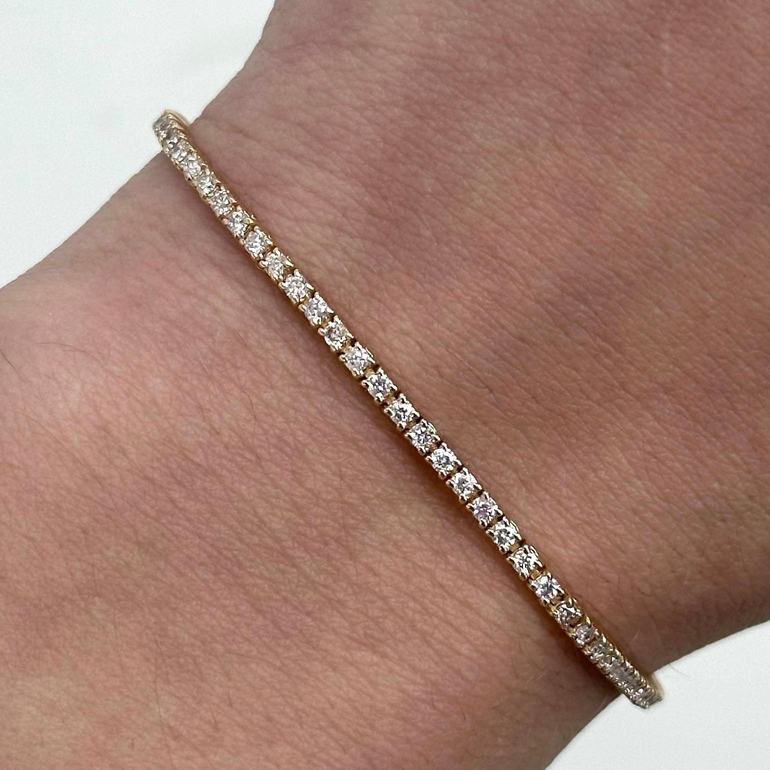 Exquisite and timeless diamonds tennis bracelet, by Alexander Beverly Hills.
90 round brilliant diamonds, 1.24 carats total. Approximately G/H color and SI clarity. Four prong set in 14k rose gold, 5.36 grams, 7 inches. 
Accommodated with an