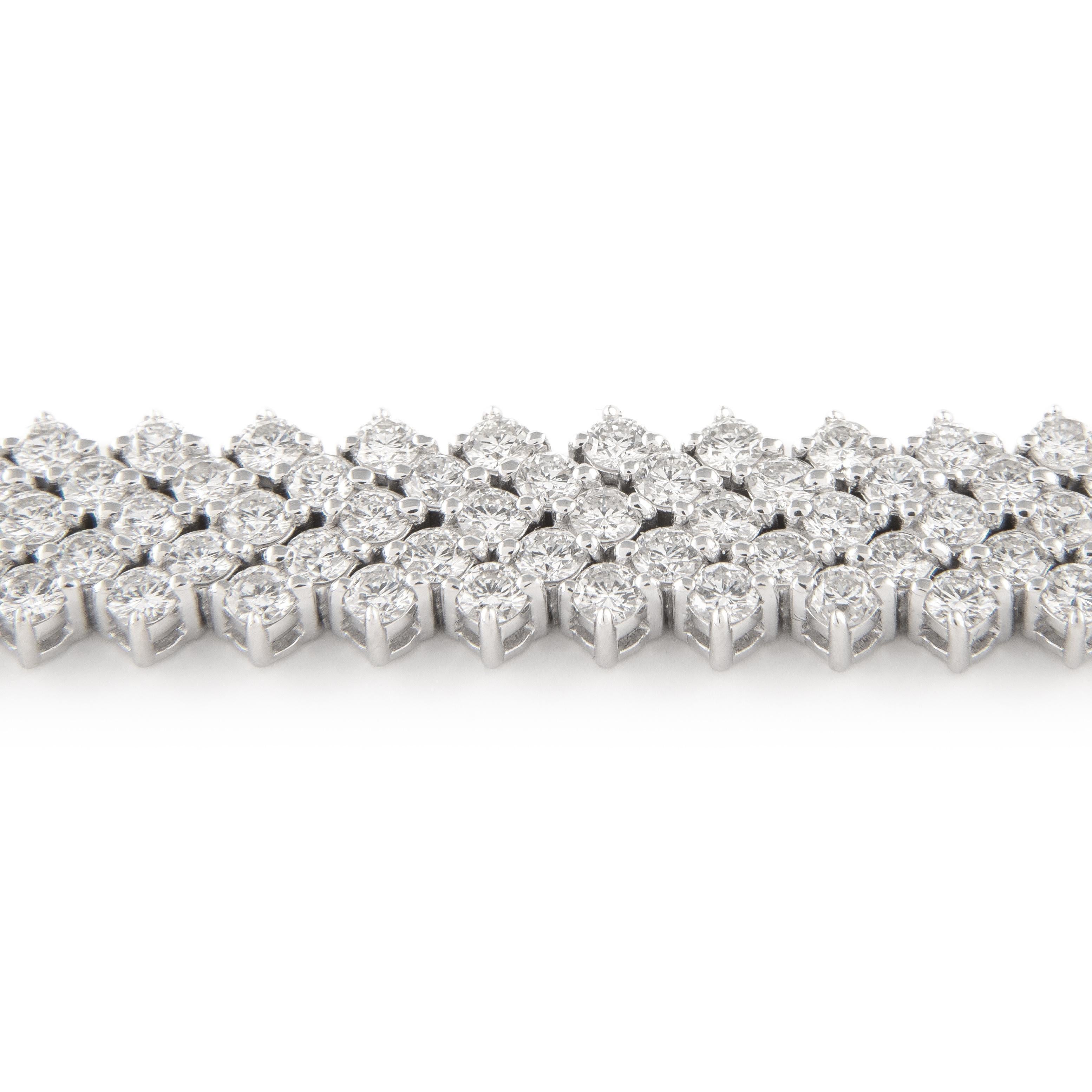 Exquisite and timeless five row diamonds tennis bracelet, by Alexander Beverly Hills.
213 diamonds total, 12.71 carats total. Approximately F-G color and VS clarity. 31.72 grams, 18k white gold, 7 inches. 
Accommodated with an up-to-date digital