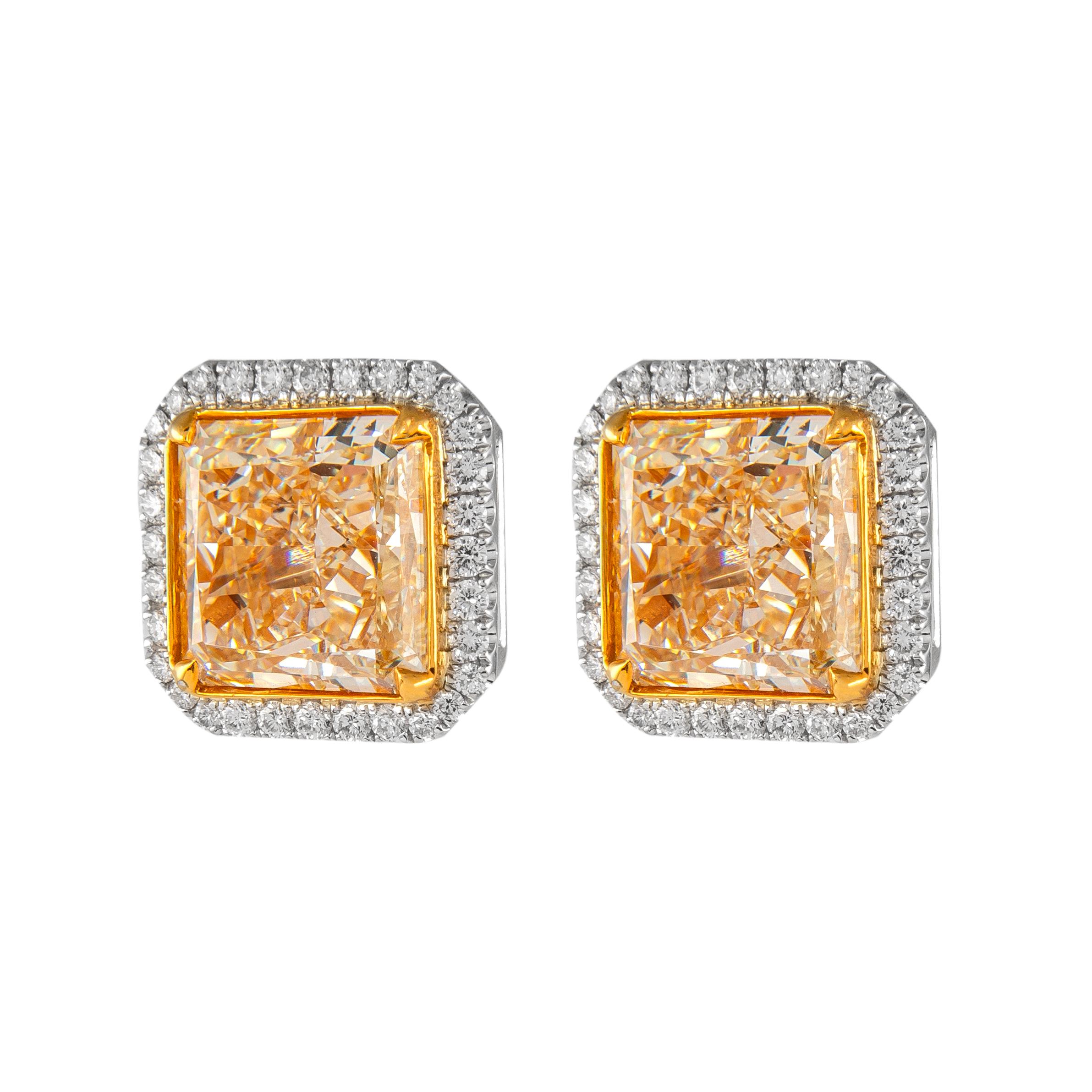 Stunning yellow diamond stud earrings with diamond halo, EGL certified. High jewelry by Alexander Beverly Hills.  
13.64 carats total diamond weight.
2 radiant cut diamonds, 12.84 carats. Both Fancy Yellow color, one stone VS1 clarity and the other
