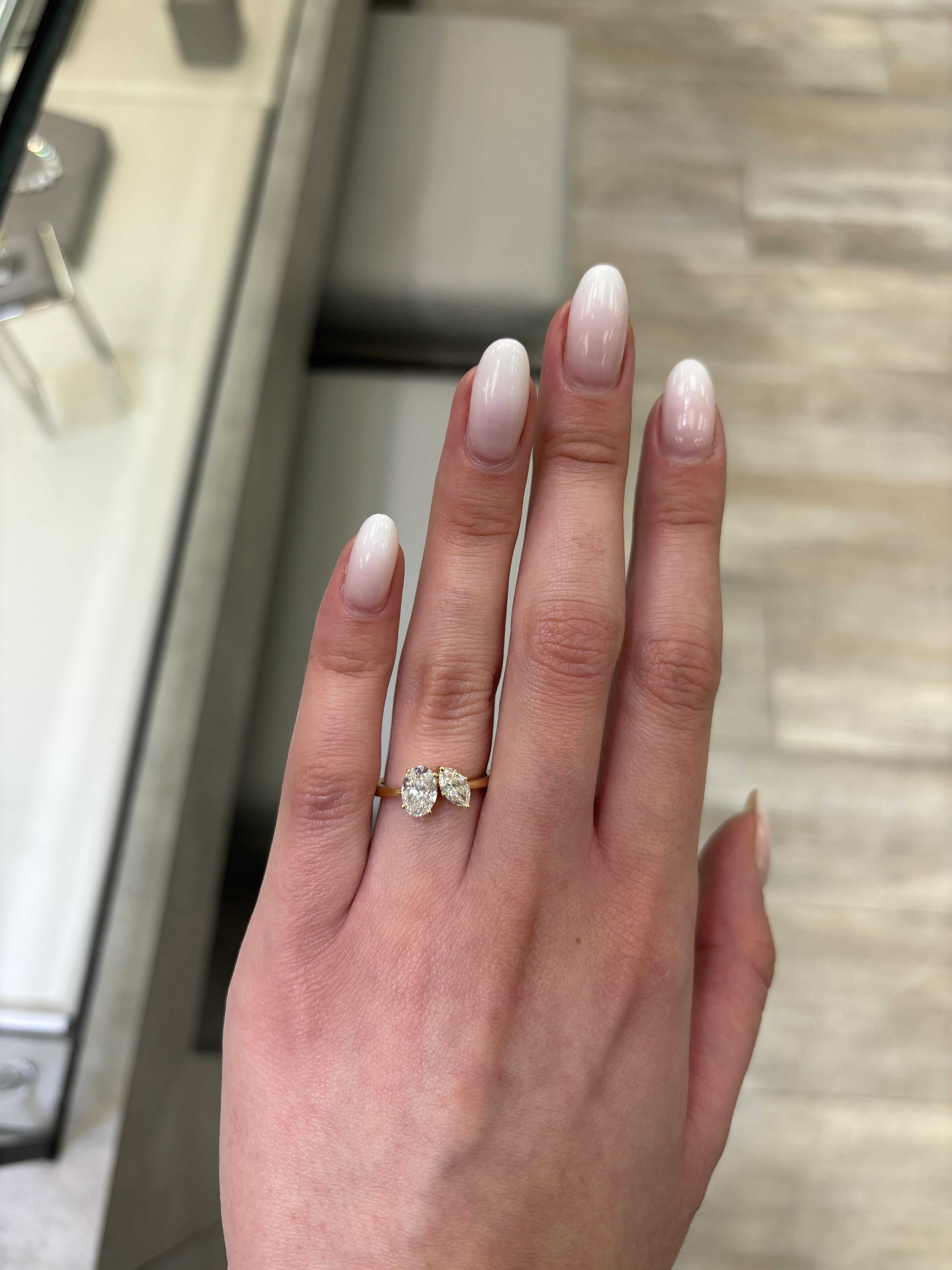 Stunning modern floating diamond open shank abstract toi et moi ring, by Alexander Beverly Hills.
1.43 carats total diamond weight.
1 oval diamond, 1.02 carats. Approximately D color grade and SI1 clarity grade. 1 marquise diamond, 0.41 carats.