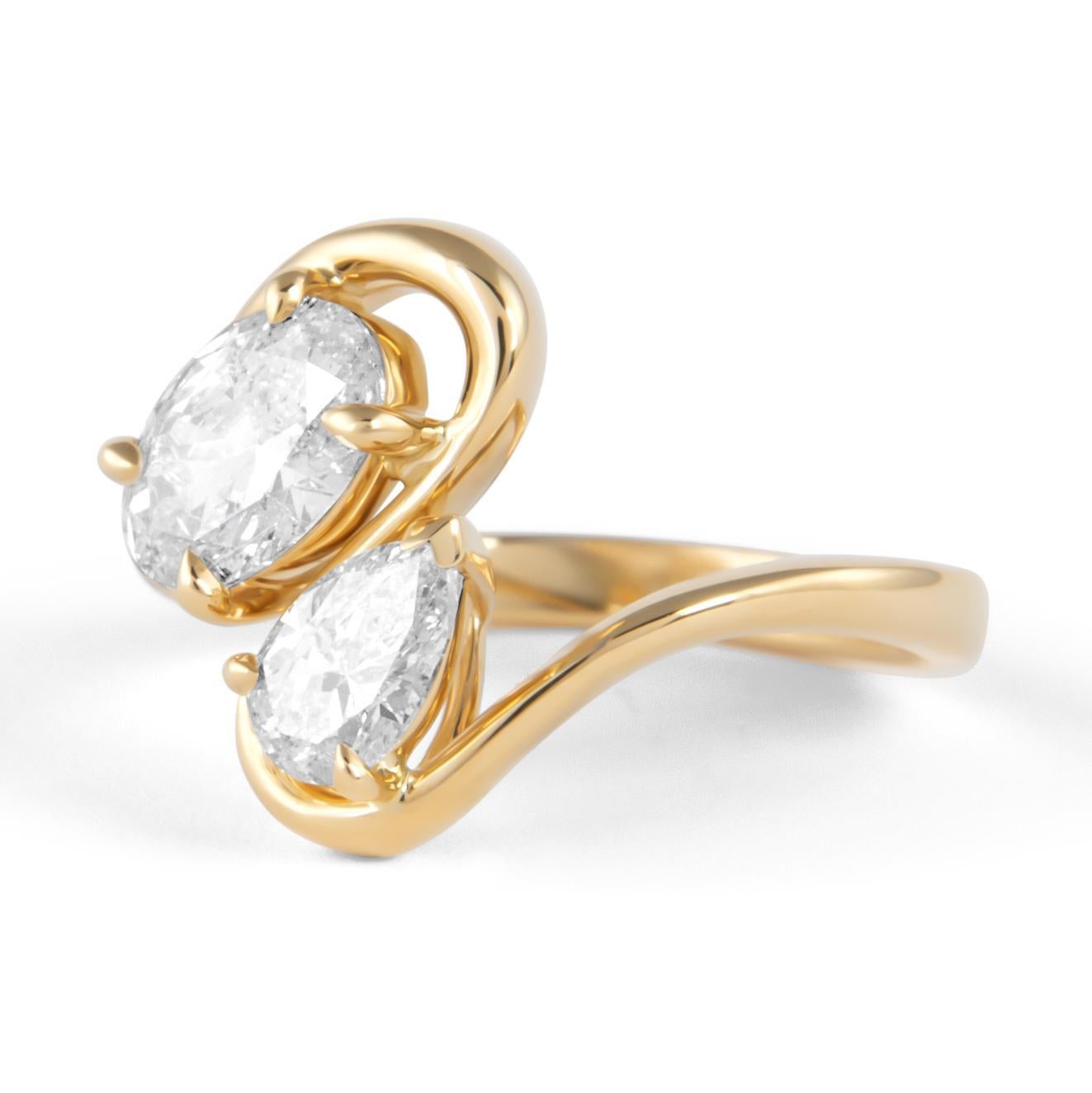 Étonnante bague moderne en diamant flottant à tige ouverte, abstraite toi et moi, par Alexander Beverly Hills.
1 diamant ovale et 1 diamant poire, 1,48 carats. Couleur G/H et pureté SI2. Or jaune 18 carats, 5,12 grammes, taille de bague actuelle