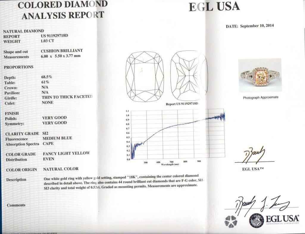 Stunning modern EGL certified yellow diamond with halo ring, two-tone 18k yellow and white gold, split shank. By Alexander Beverly Hills
1.55 carats total diamond weight.
1.03 carat cushion cut Fancy Light Yellow color and SI2 clarity diamond, EGL