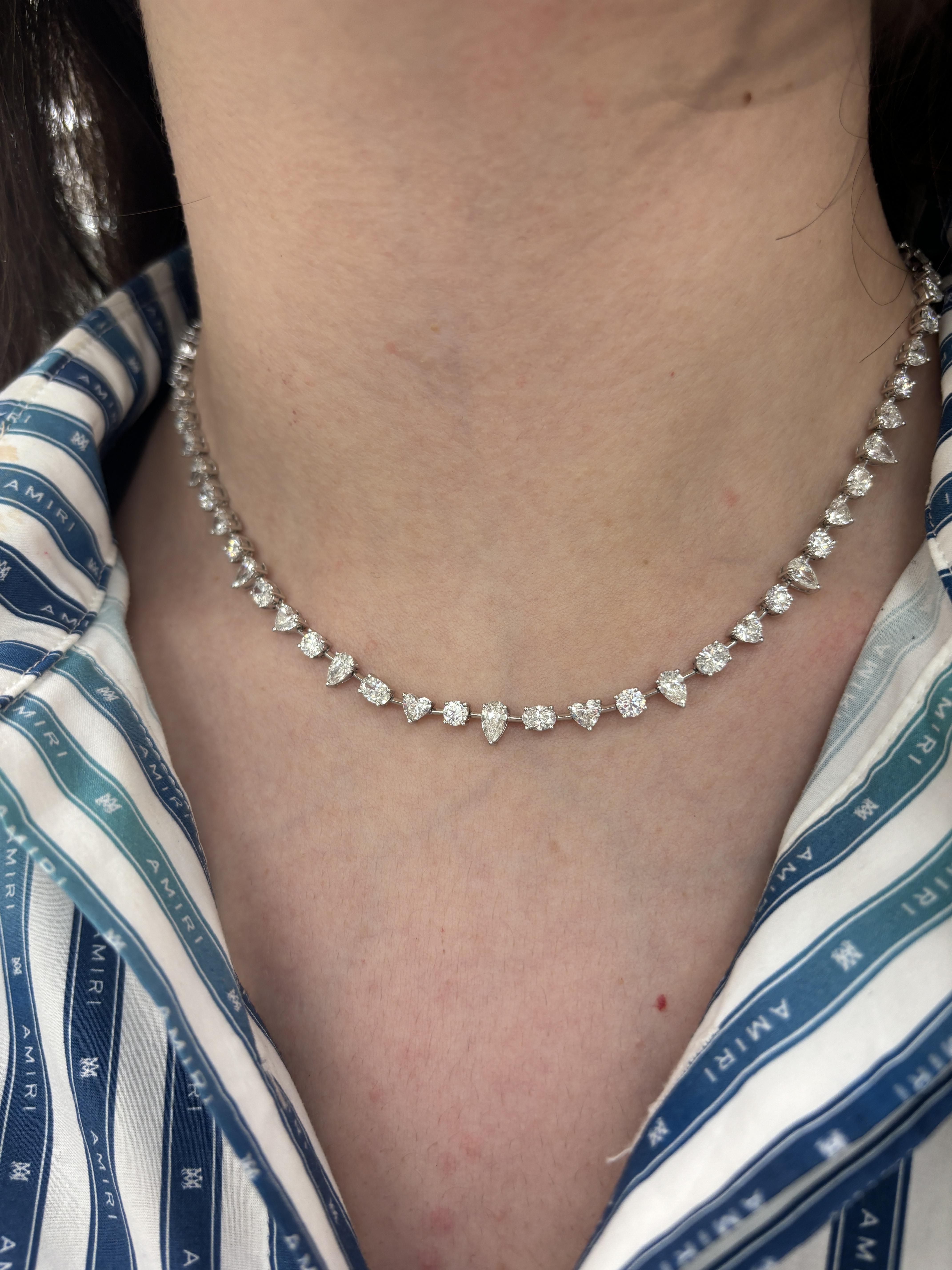 Beautiful and modern alternating mixed natural diamond necklace. High jewelry by Alexander Beverly Hills.
15.28 carats total diamond weight.
24 heart brilliant diamonds, 5.18 carats. 16 pear shape diamonds, 4.06 carats. 12 oval brilliant diamonds,
