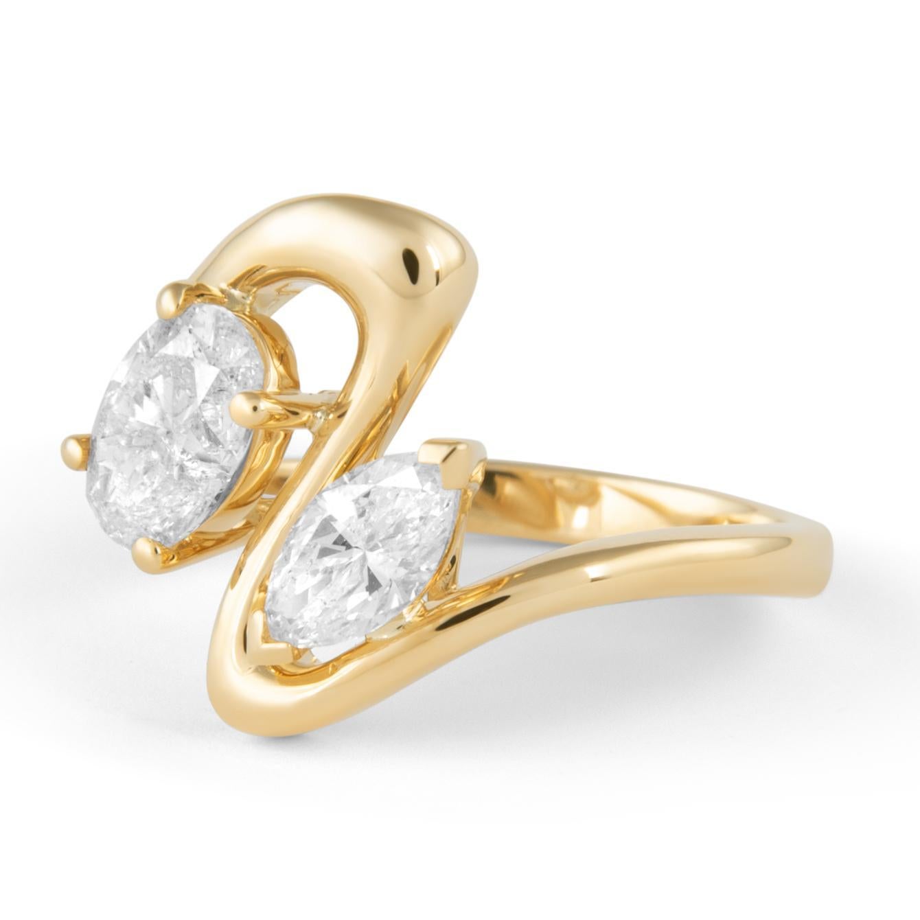 Stunning modern floating natural diamond open shank abstract toi et moi ring, by Alexander Beverly Hills.
Oval diamond ring and marquise diamond ring, 1.53 carats. Approximately H/I color SI2 clarity. 18-karat yellow gold, 5.82 grams, current ring
