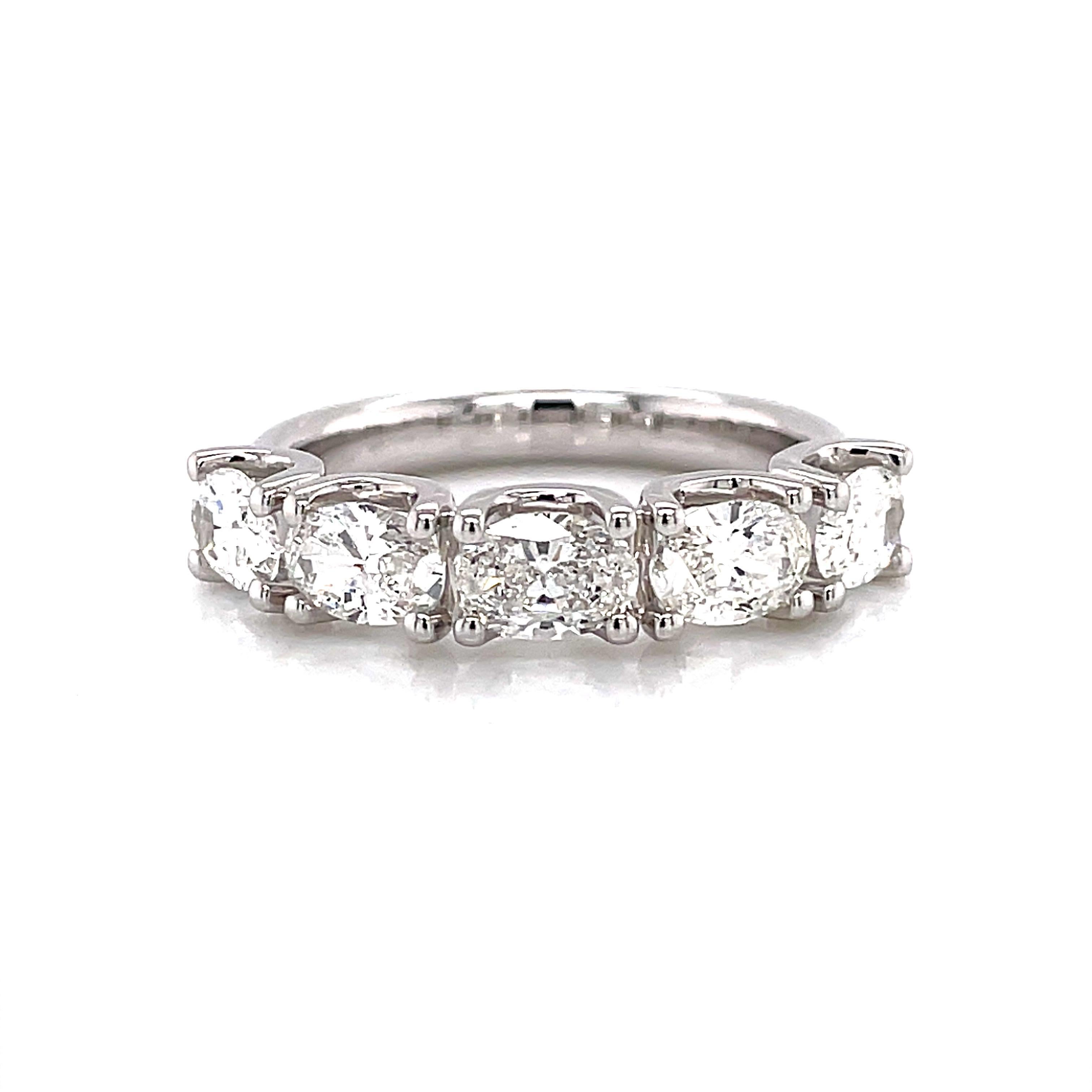 Stunning oval cut diamond eternity band, by Alexander Beverly Hills.
5 oval diamonds, 1.63 carats total. F/G color and VS clarity. Set in 18k white gold, 4.24 grams, size 6.5. 
Accommodated with an up to date digital appraisal by a GIA G.G., once