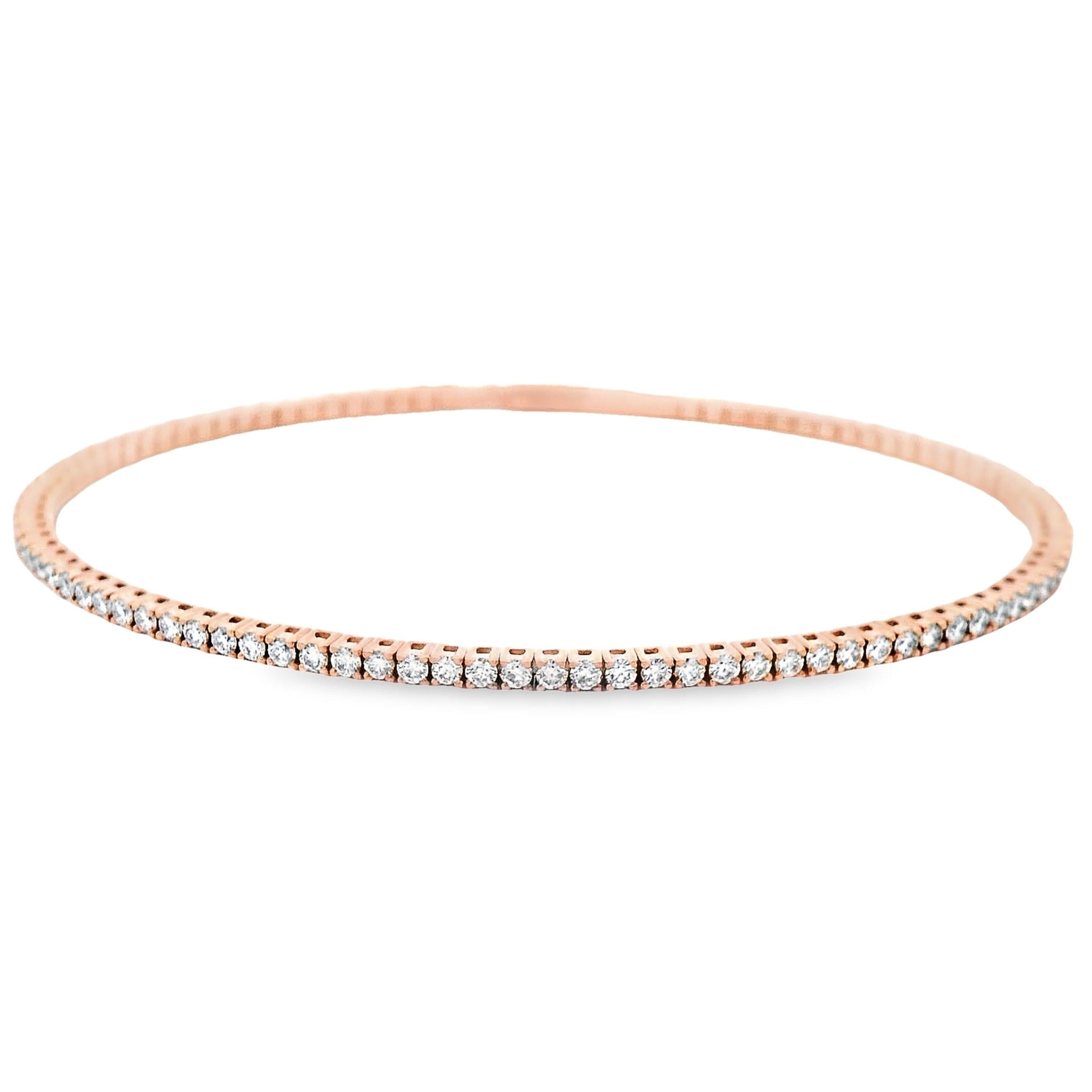 Exquisite modern diamond tennis bangle, by Alexander Beverly Hills.
71 round diamonds, 1.87 carats. Approximately E/F color and SI clarity. 14-karat rose gold, 7.24 grams, 6.5in.
Accommodated with an up-to-date digital appraisal by a GIA G.G. once