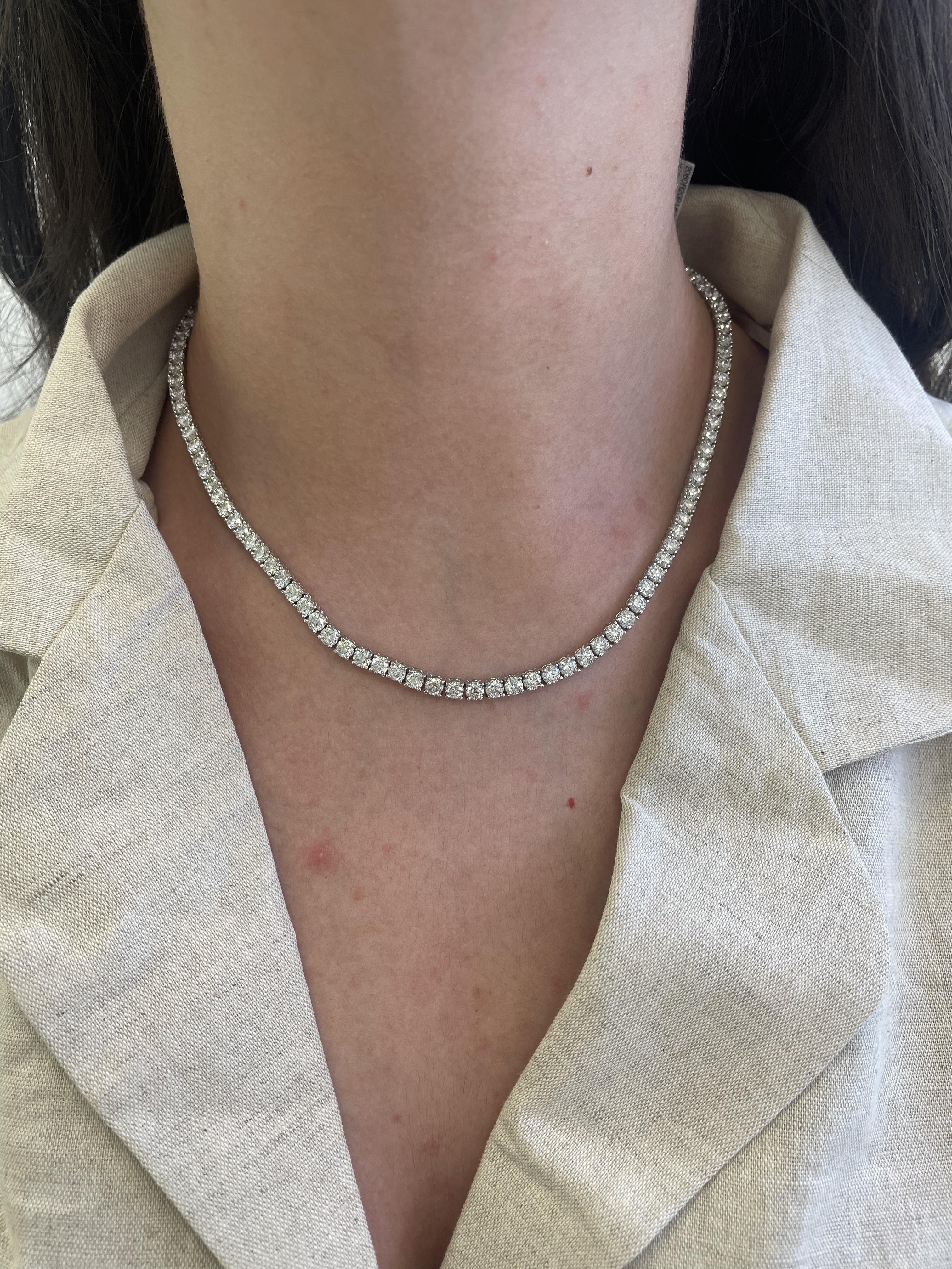 Beautiful and classic diamond tennis necklace. High jewelry by Alexander Beverly Hills.
106 round brilliant diamonds, 20.60 carats. Approximately F/G color and SI clarity. 18k white gold, 32.79 grams, 16.5in.
Accommodated with an up-to-date digital