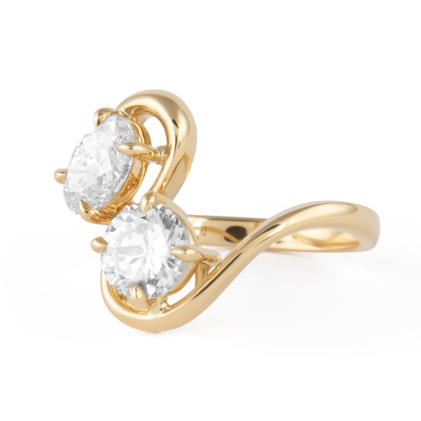Stunning modern floating diamond open shank abstract toi et moi ring, by Alexander Beverly Hills.
1 oval diamond and 1 round diamond, 2.13 carats. Approximately D/E color grade and SI clarity grade. 18-karat yellow gold, 5.62 grams, current ring