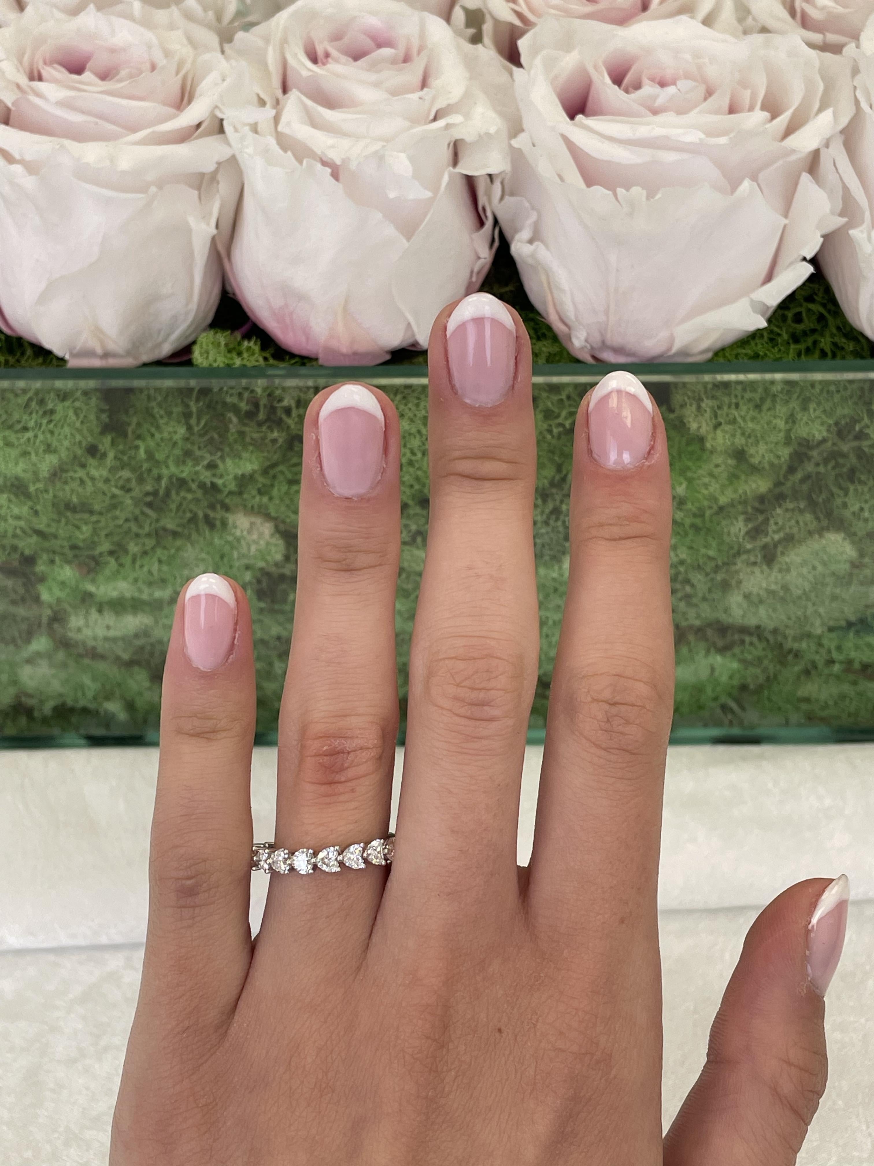 Stunning heart shape diamond eternity band. High jewelry by Alexander Beverly Hills.
9 heart brilliant diamonds, 2.14 carats. D-F color and VVS2/VS1 clarity. Platinum, 3.30 grams, size 5.75. 
Accommodated with an up to date digital appraisal by a