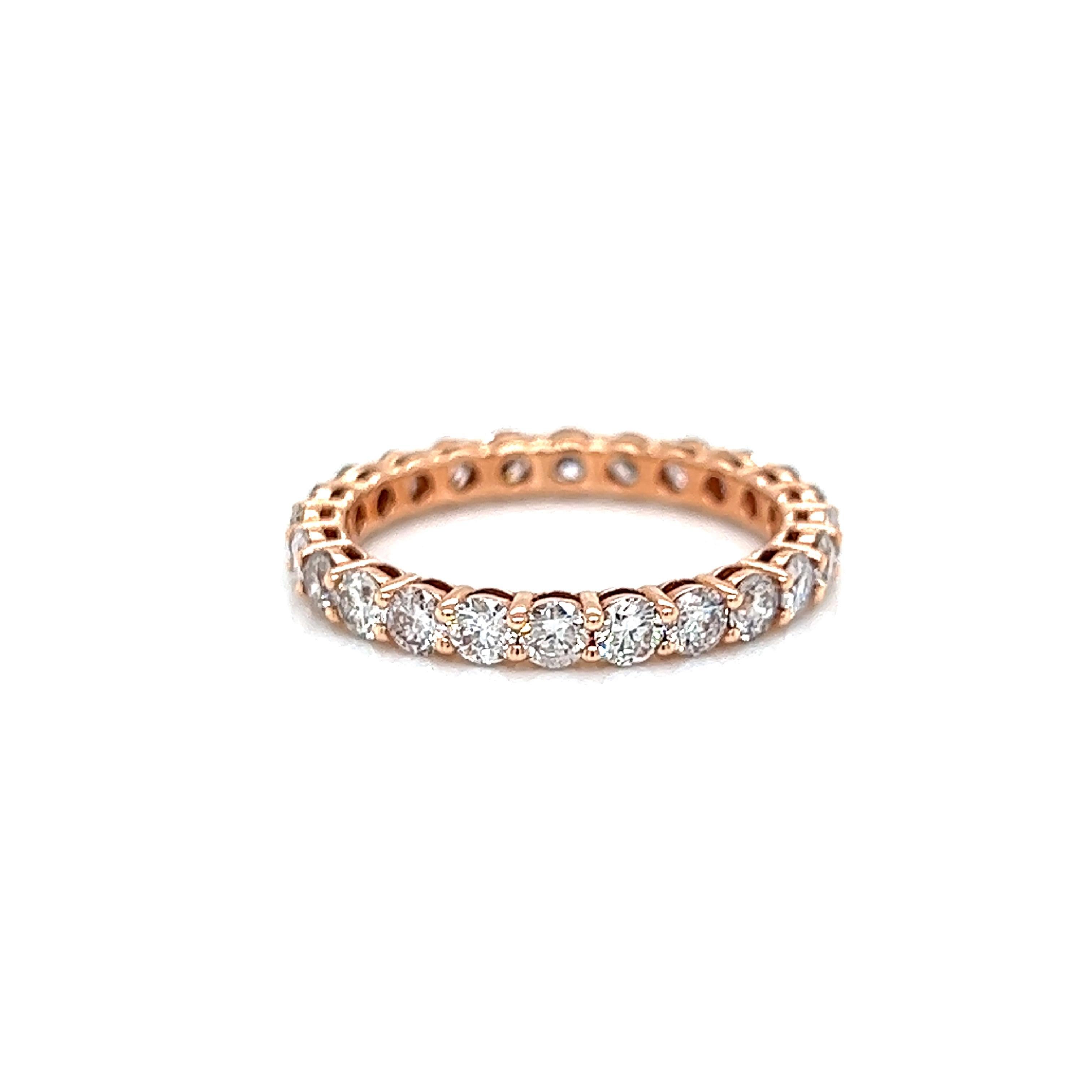 Timeless diamond eternity band. By Alexander Beverly Hills.
24 round brilliant diamonds, 1.69 carats. Approximately G/H color and SI clarity. Set in 14k rose gold, 1.74 grams, size 6. 
Accommodated with an up-to-date appraisal by a GIA G.G. once