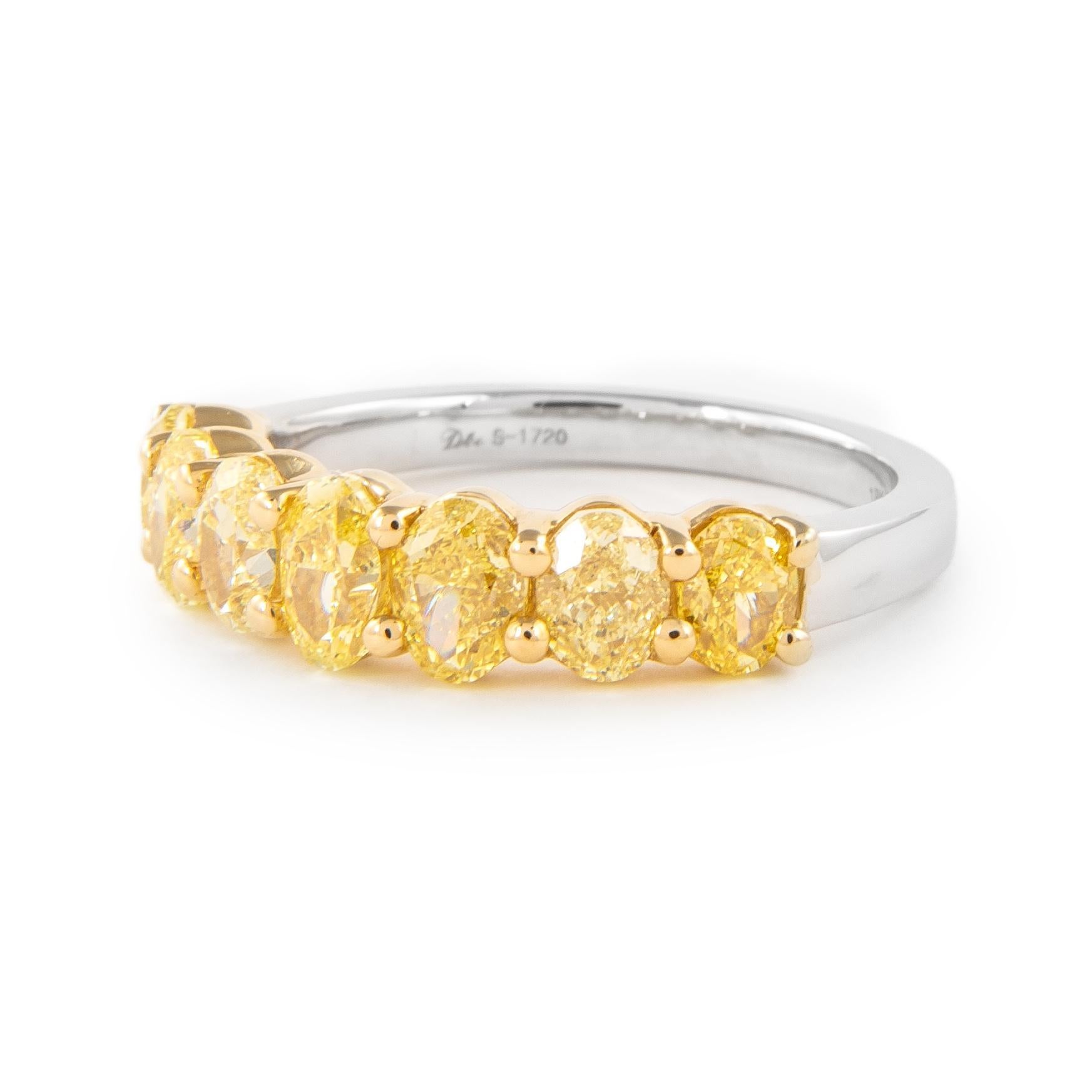Stunning yellow oval diamond half eternity band, by Alexander Beverly Hills.
7 oval diamonds, 2.20 carats total. Approximately Fancy Yellow color and VS1 clarity. Set in 18-karat yellow and white gold, 4.22 grams, size 6.25.
Accommodated with an up
