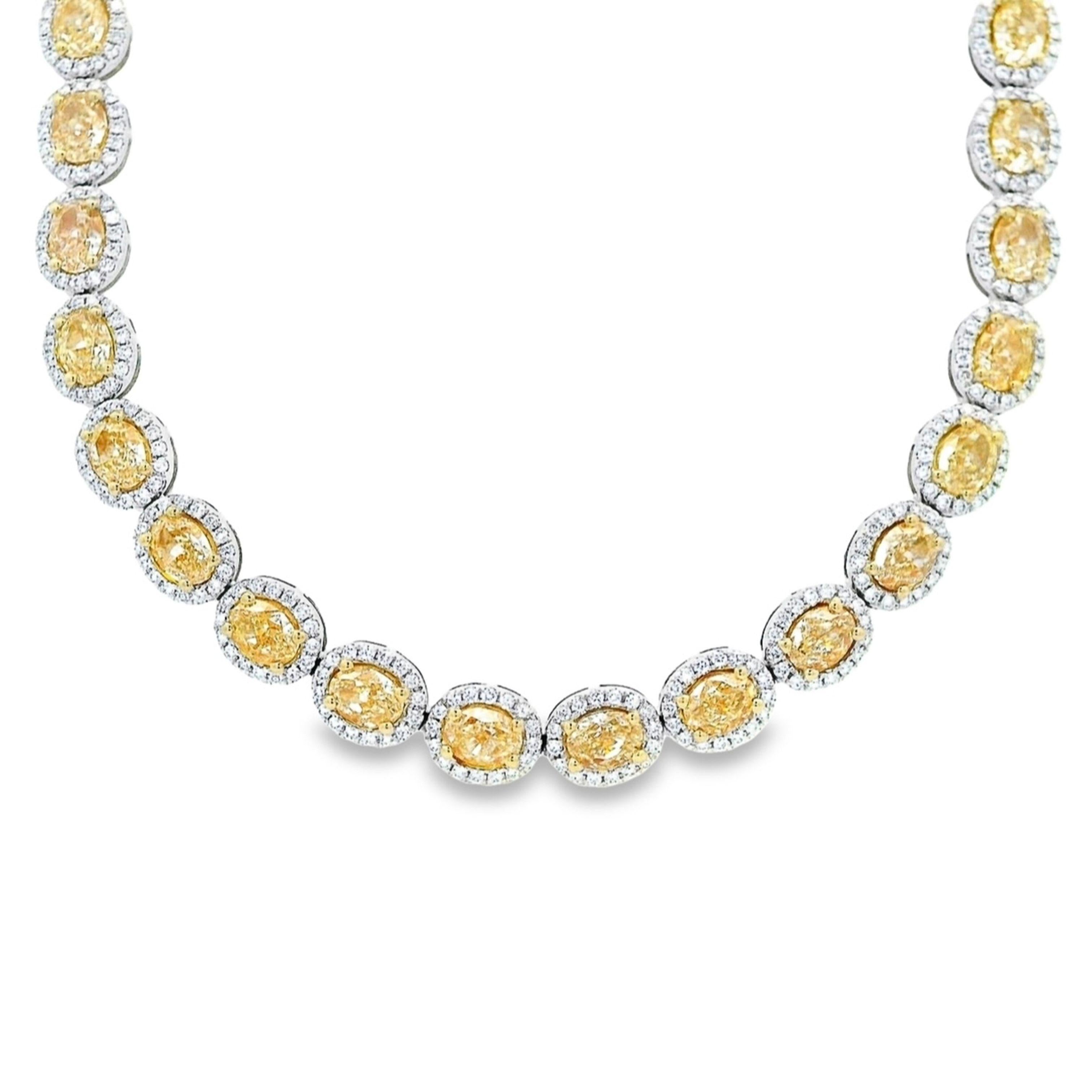 Stunning yellow oval diamond bracelet in 18k two tone gold, high jewelry by Alexander Beverly Hills.
22.37 carats total diamond weight.
52 oval diamonds, 19.28 carats. Approximately Fancy/Fancy Light Yellow color and VS clarity. Complimented by 832