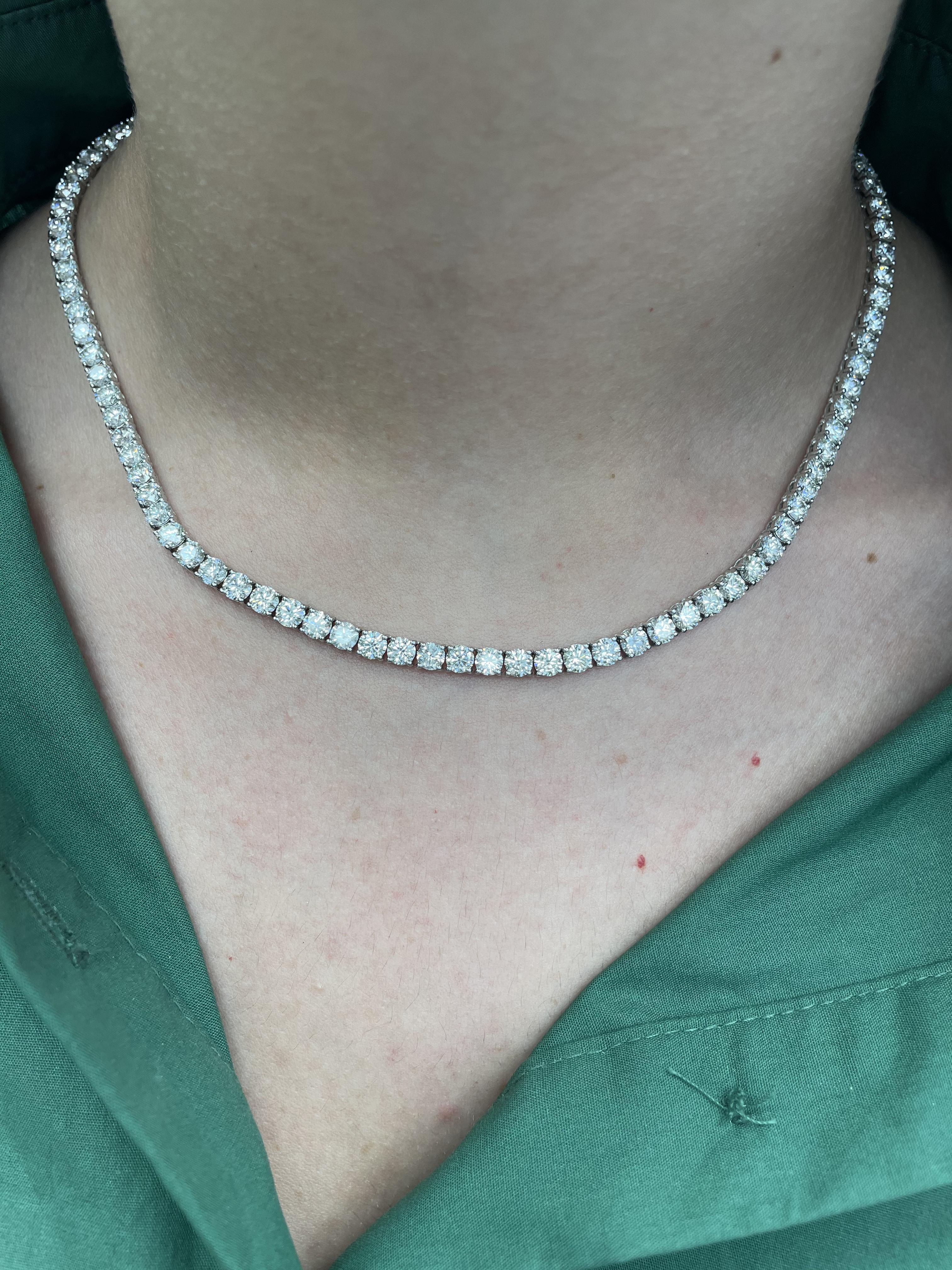 Beautiful and classic natural diamond tennis necklace. By Alexander Beverly Hills.
100 round brilliant diamonds, 23.61ct. Approximately G/H color and SI clarity. 18k white gold, 30.99 grams, 16.5in.
Accommodated with an up-to-date digital appraisal