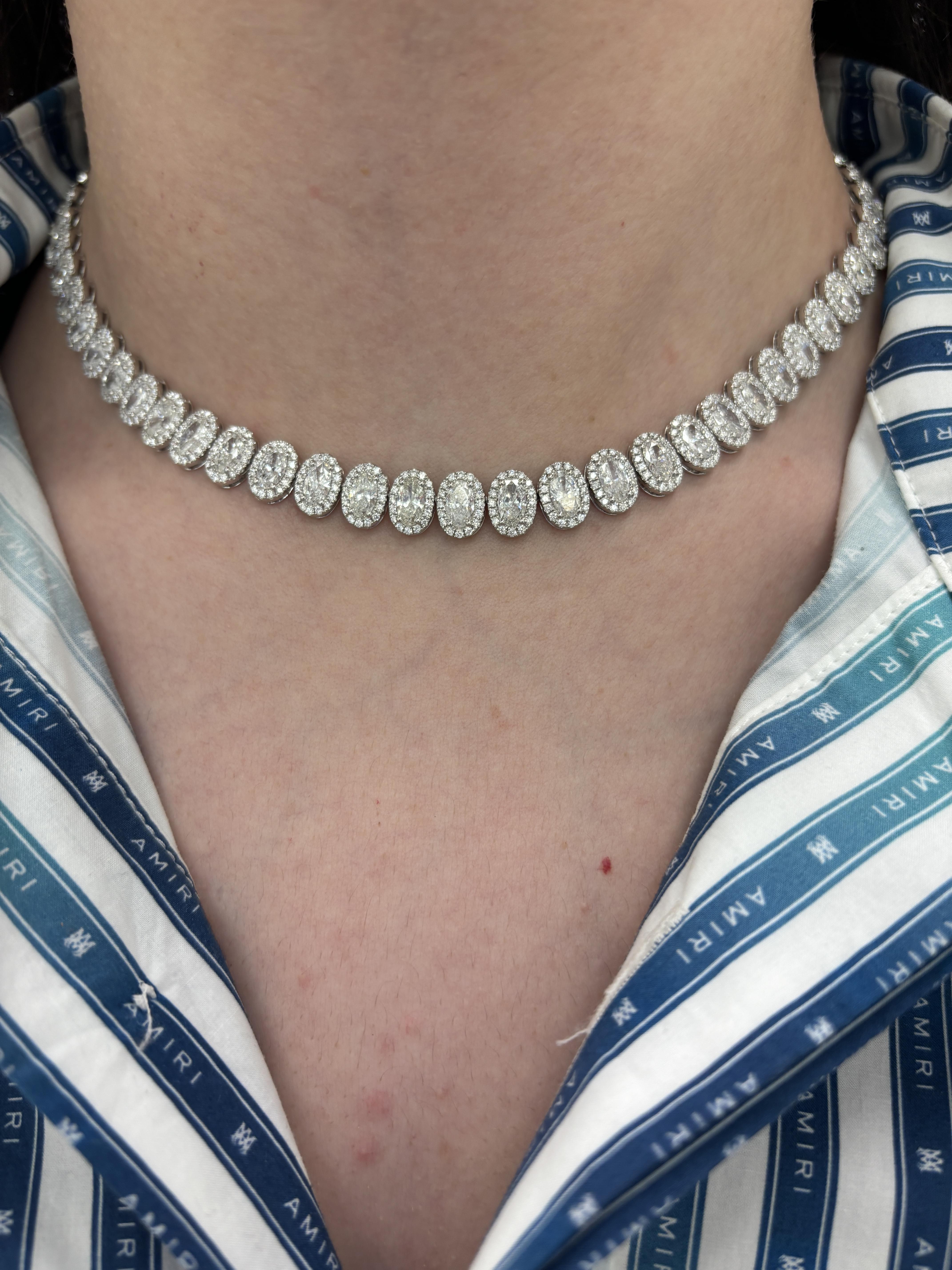 Stunning natural oval diamond tennis necklace east-west. High jewelry by Alexander Beverly Hills.
24.22 carats total diamond weight.
60 oval diamonds, 19.61 carats total. Approximately F/G color and SI1 clarity. Complimented with 959 round brilliant