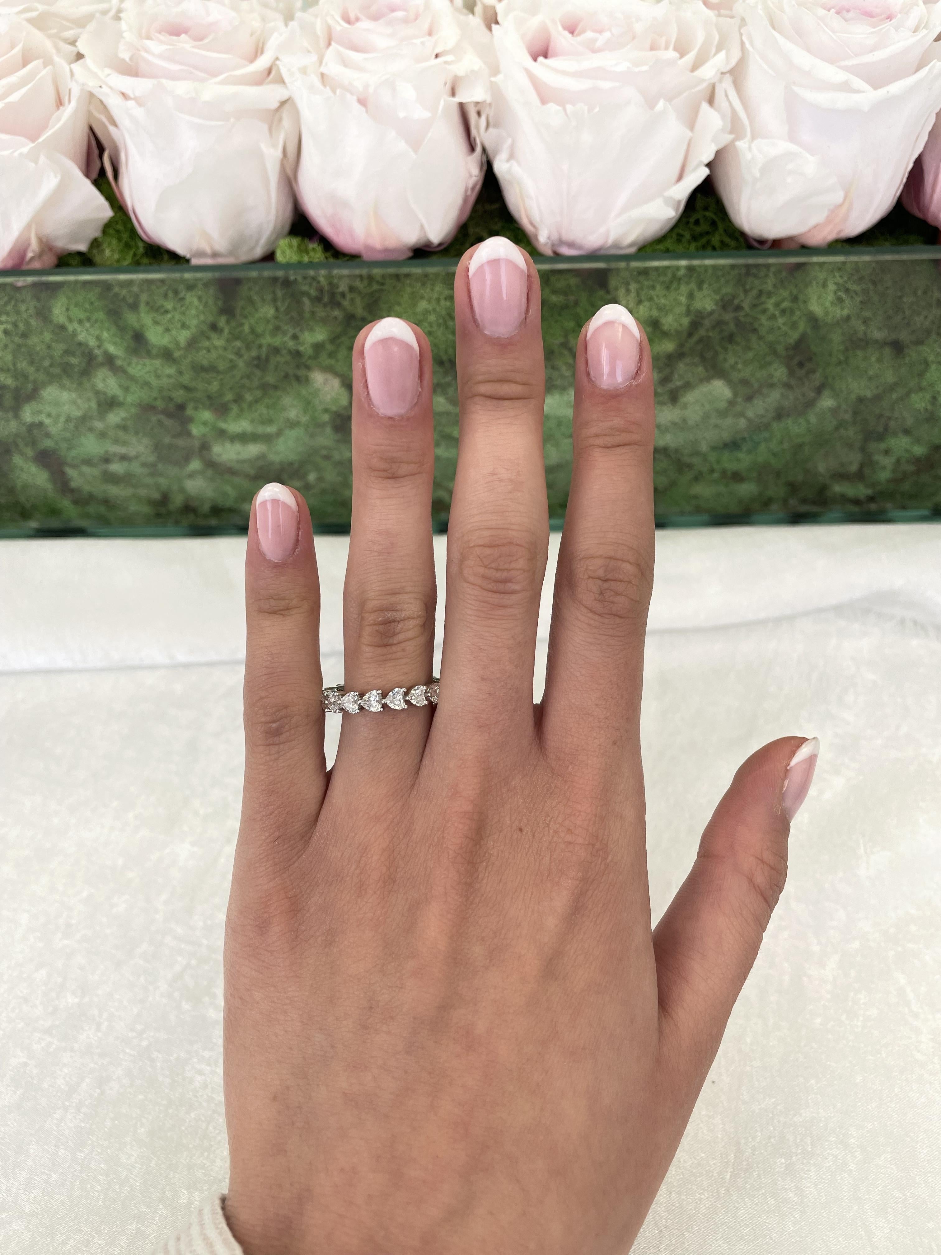 Stunning heart shape diamond eternity band, By Alexander Beverly Hills.
17 heart brilliant diamonds, 2.44 carats. Approximately D/E color and VVS1/VVS2 clarity. Platinum, 4.61 grams, size 6.75. 
Accommodated with an up-to-date digital appraisal by a