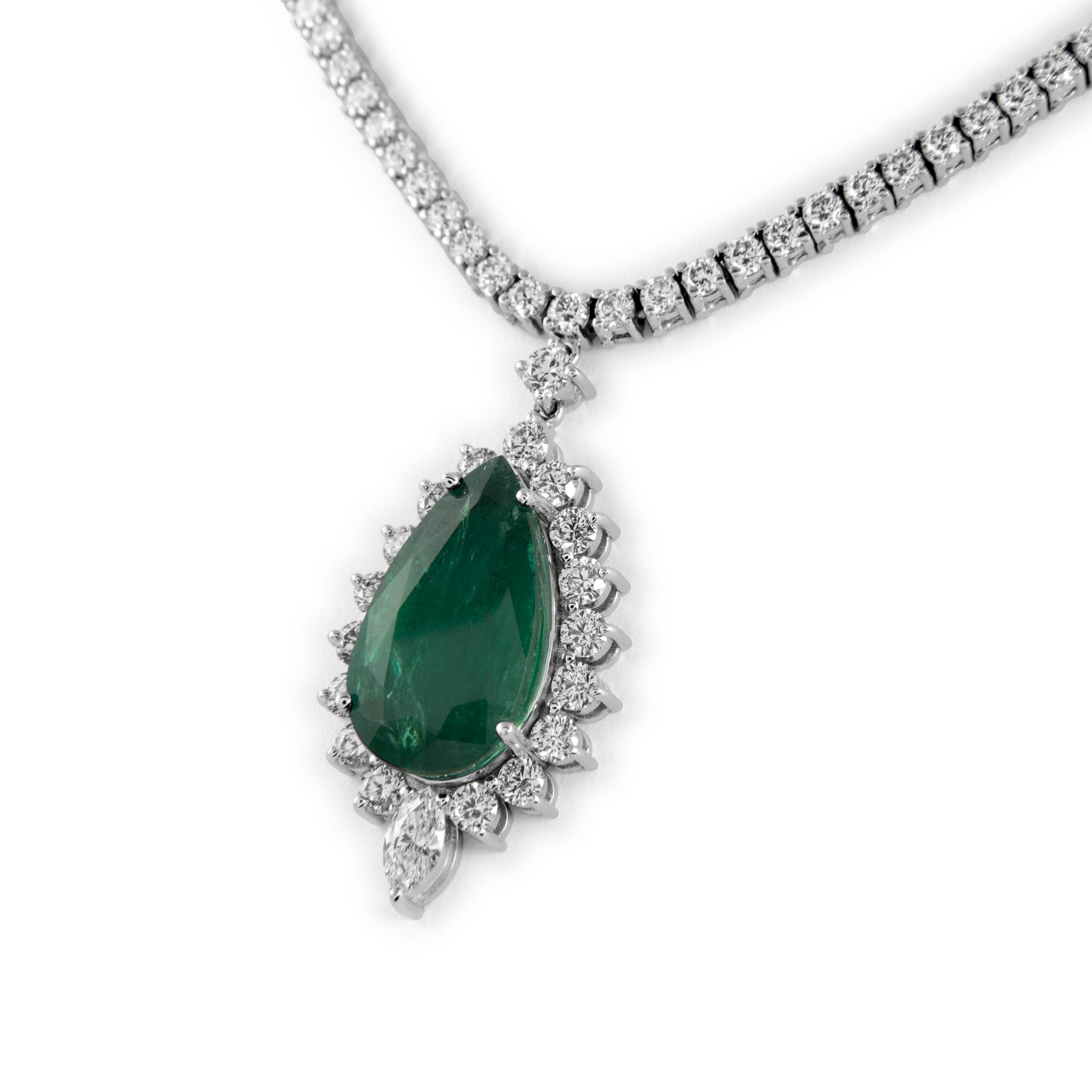 Beautiful emerald drop pendant and natural diamond tennis necklace. High jewelry Alexander Beverly Hills.
28.11 carats total gemstone weight.
14.87 carat pear shape emerald, apx F1/F2. 13.24 carats of round and marquise diamonds. Approximately H/I