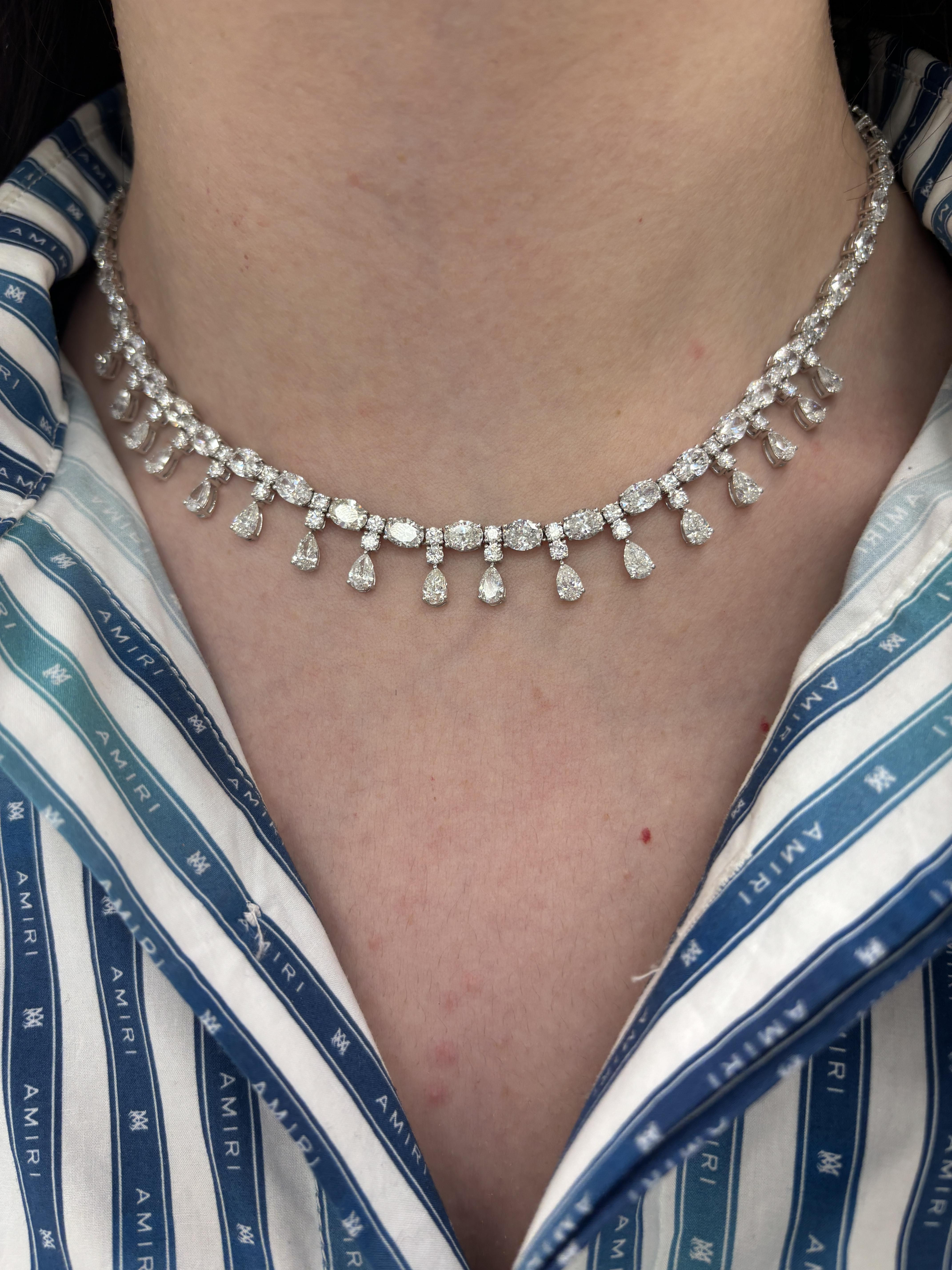 Sensational grand drop necklace with natural oval, round and pear shape diamonds. High jewelry by Alexander Beverly Hills.
28.12 carats total diamond weight.
49 oval cut diamonds, 19.84 carats. Approximately F/G color and SI clarity. 17 pear shape