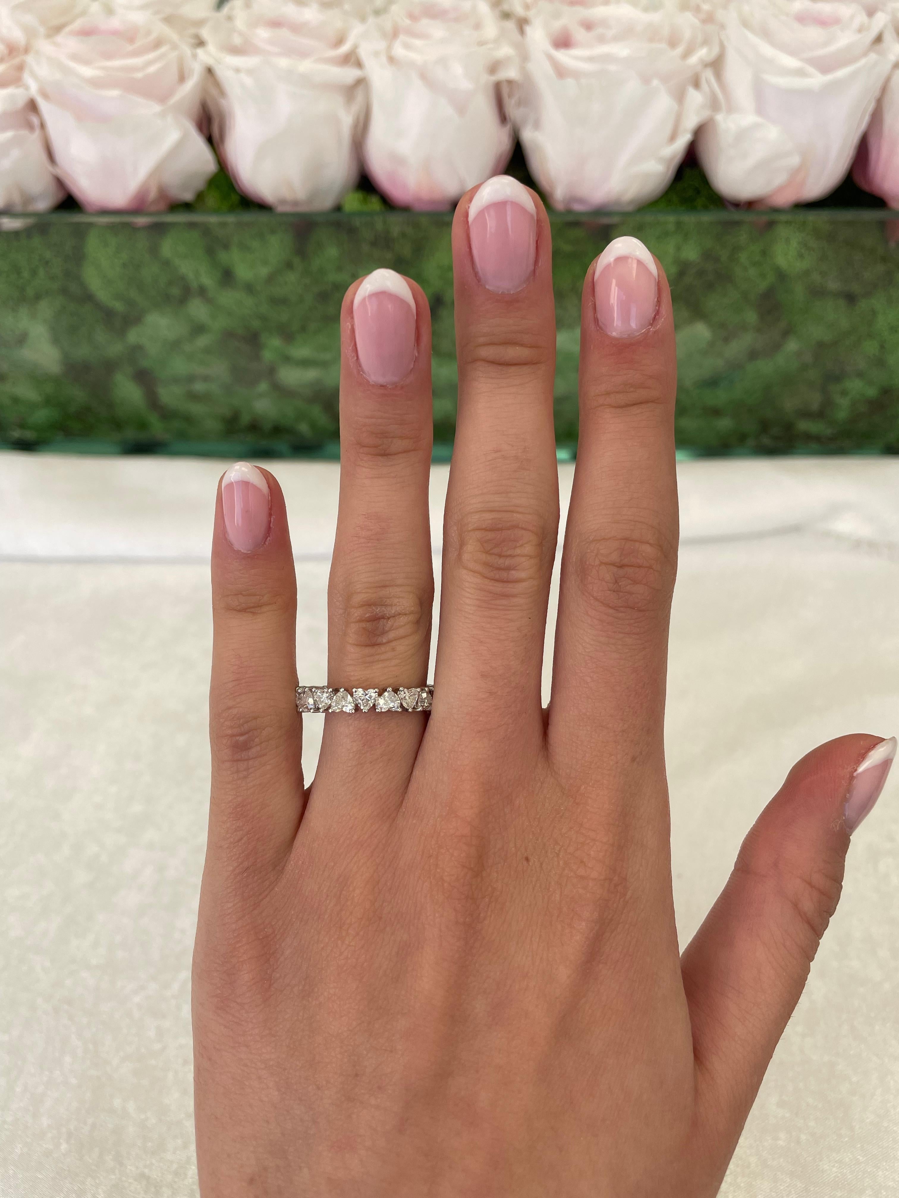 Stunning heart shape diamond eternity band. High jewelry by Alexander Beverly Hills.
20 heart brilliant diamonds, 2.82 carats. D/E color and VVS clarity. Set in 18k white gold, 2.96 grams, size 6.5.
Accommodated with an up to date digital appraisal