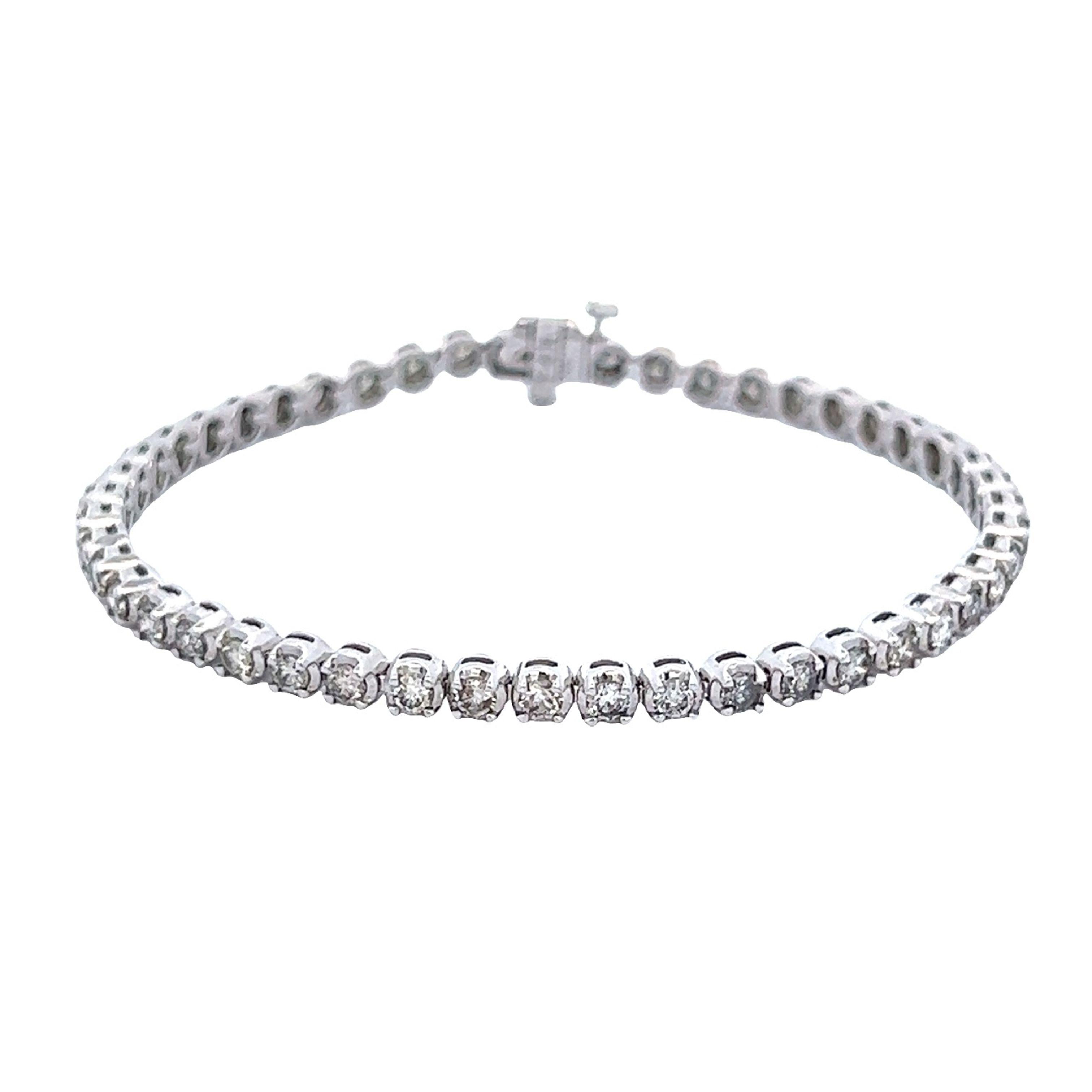 Exquisite and timeless diamonds tennis bracelet, by Alexander Beverly Hills.
48 round brilliant diamonds, 3.15 carats. Approximately I/J color and SI clarity. Four prong set in 14k white gold, 9.16 grams, 7 inches. 
Accommodated with an up-to-date