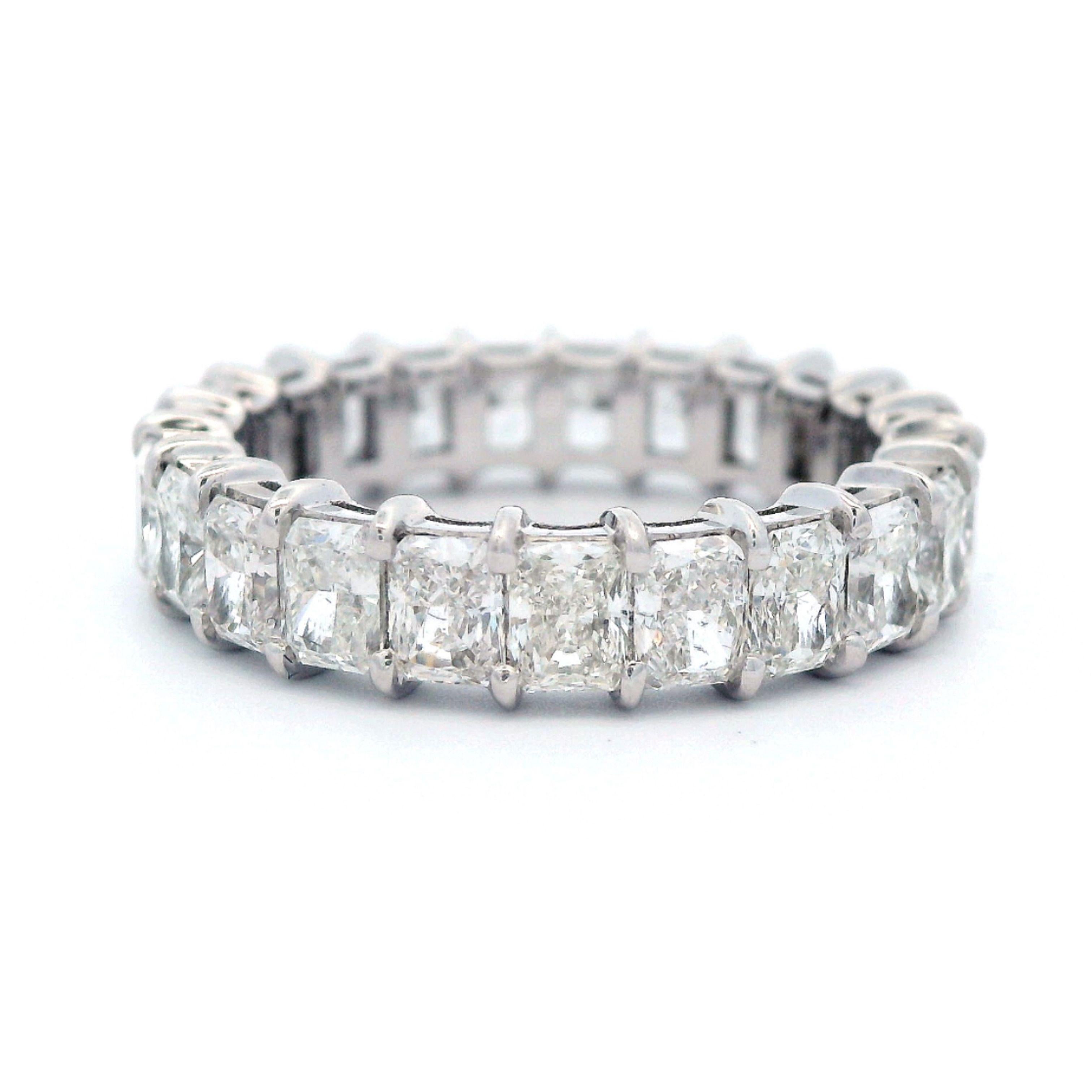 Stunning radiant cut diamond eternity band, by Alexander Beverly Hills.
23 radiant cut diamonds, 3.44 carats total. Approximately F/G color and VS clarity. Set in 18k white gold, 3.22 grams, size 5.5. 
Accommodated with an up-to-date digital