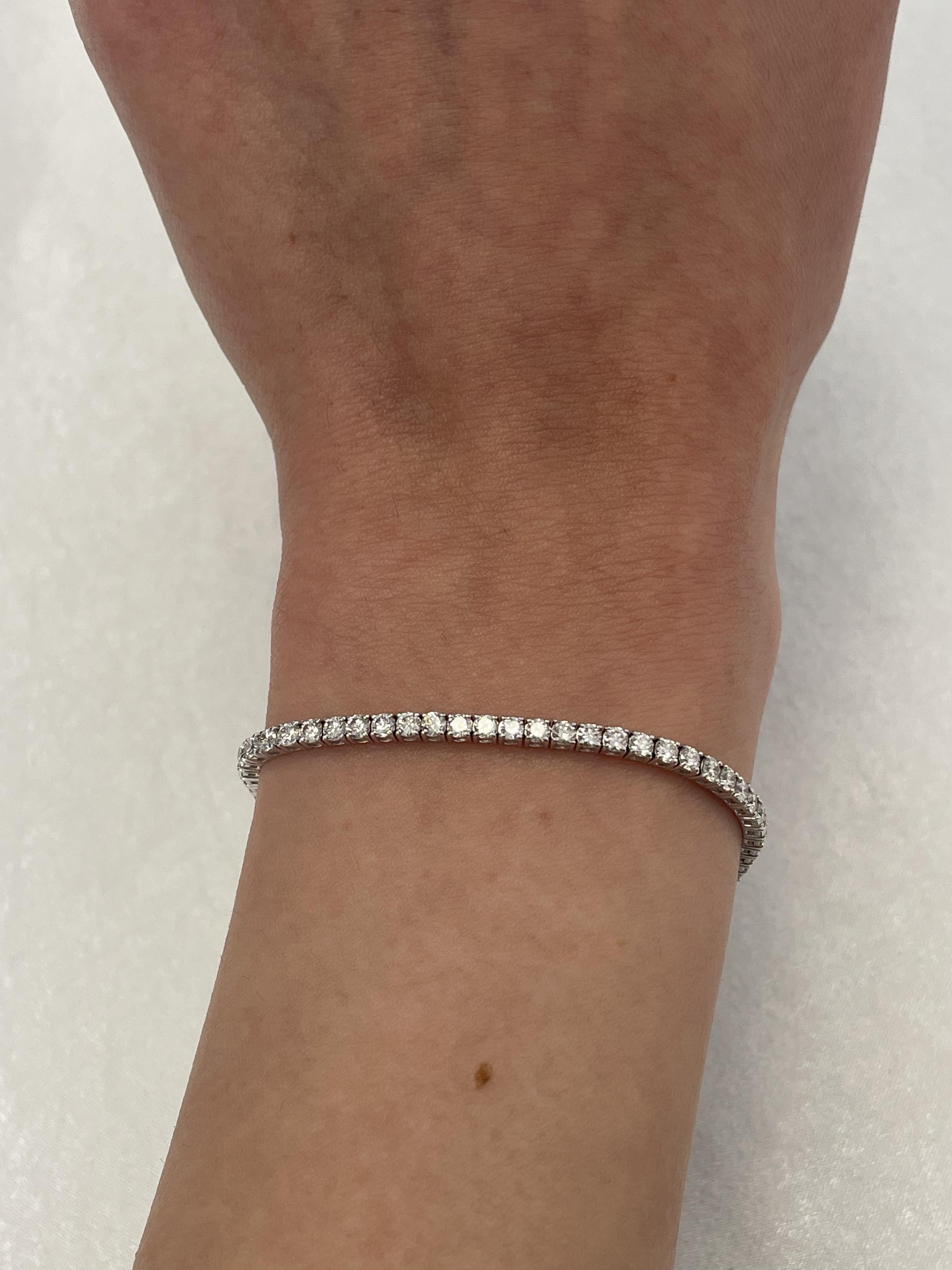 Exquisite and timeless diamonds tennis bracelet, by Alexander Beverly Hills.
66 round brilliant diamonds, 3.72 carats total. Approximately G color and VS1 clarity. Four prong set in 14-karat white gold, 6.53 grams, 7 inches.
Accommodated with an