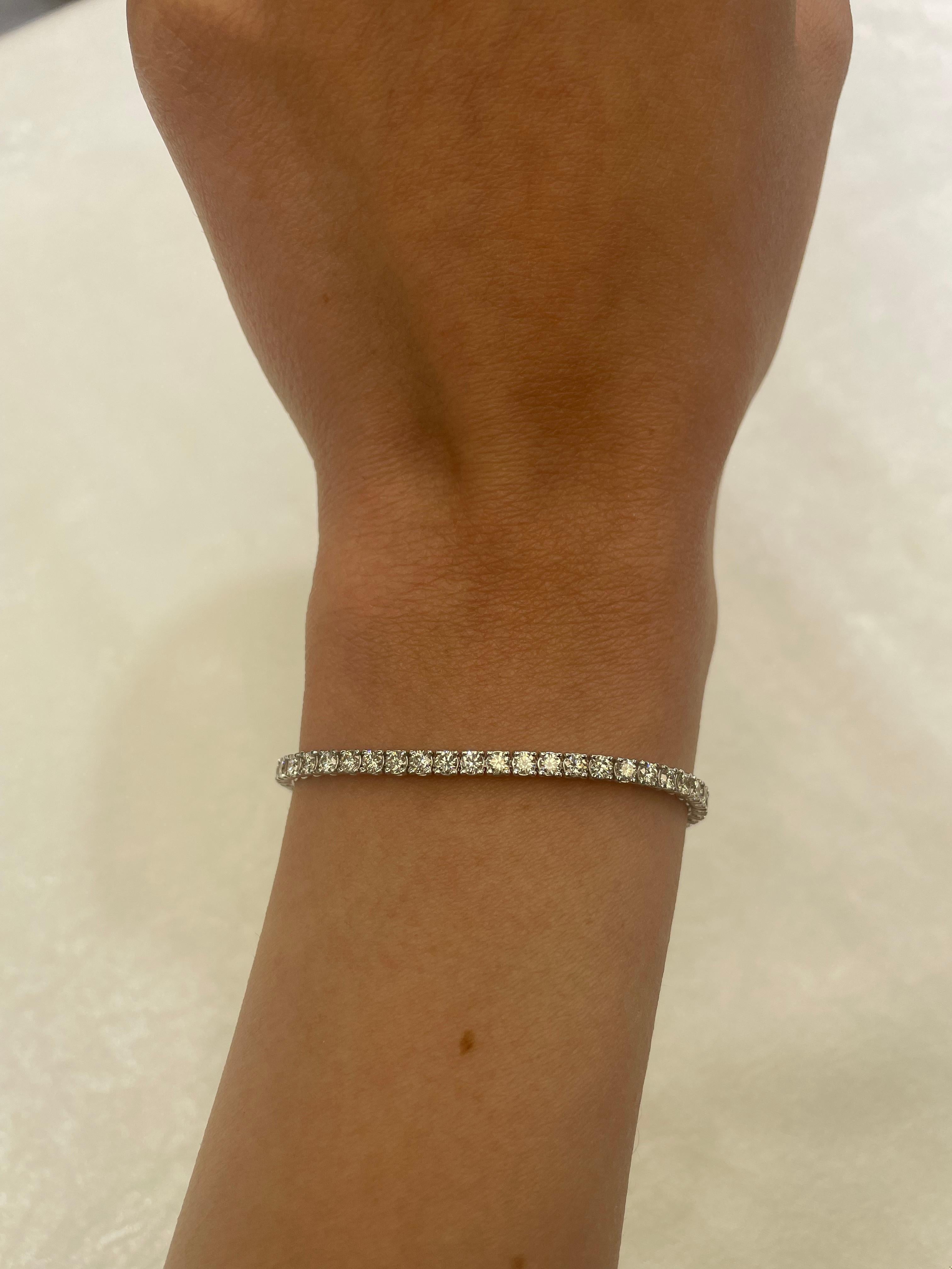 Exquisite and timeless diamonds tennis bracelet, by Alexander Beverly Hills.
66 round brilliant diamonds, 3.74 carats total. Approximately F/G color and VS clarity. Four prong set in 14k white gold, 7.35 grams, 7 inches.
Accommodated with an up to