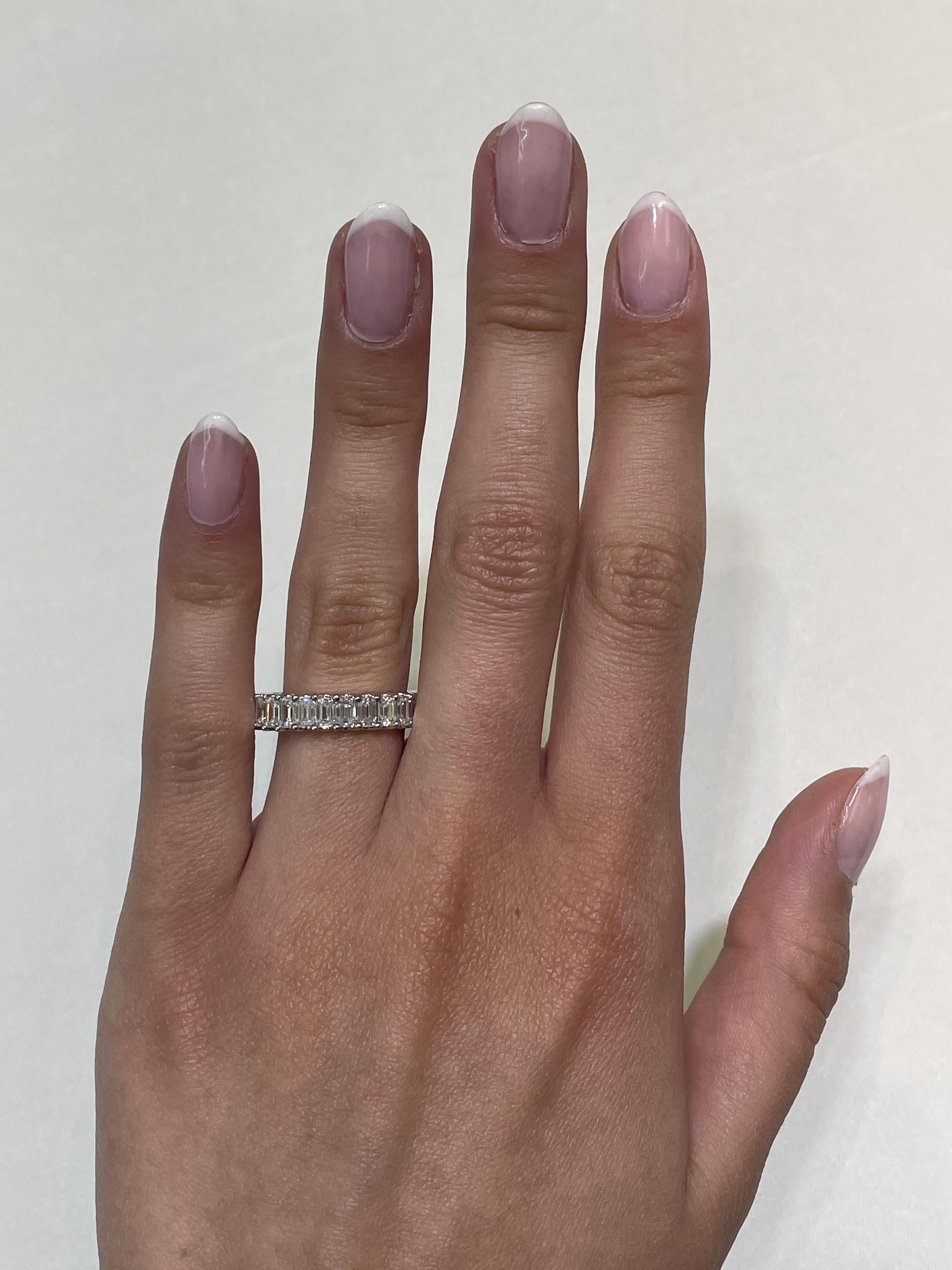 Stunning emerald cut diamond eternity band, by Alexander Beverly Hills.
26 emerald cut diamonds, 3.95 carats total. D-F color and VVS2 clarity. U prong set in 18k white gold, 3.83 grams, size 6.5. 
Accommodated with an up-to-date appraisal by a GIA