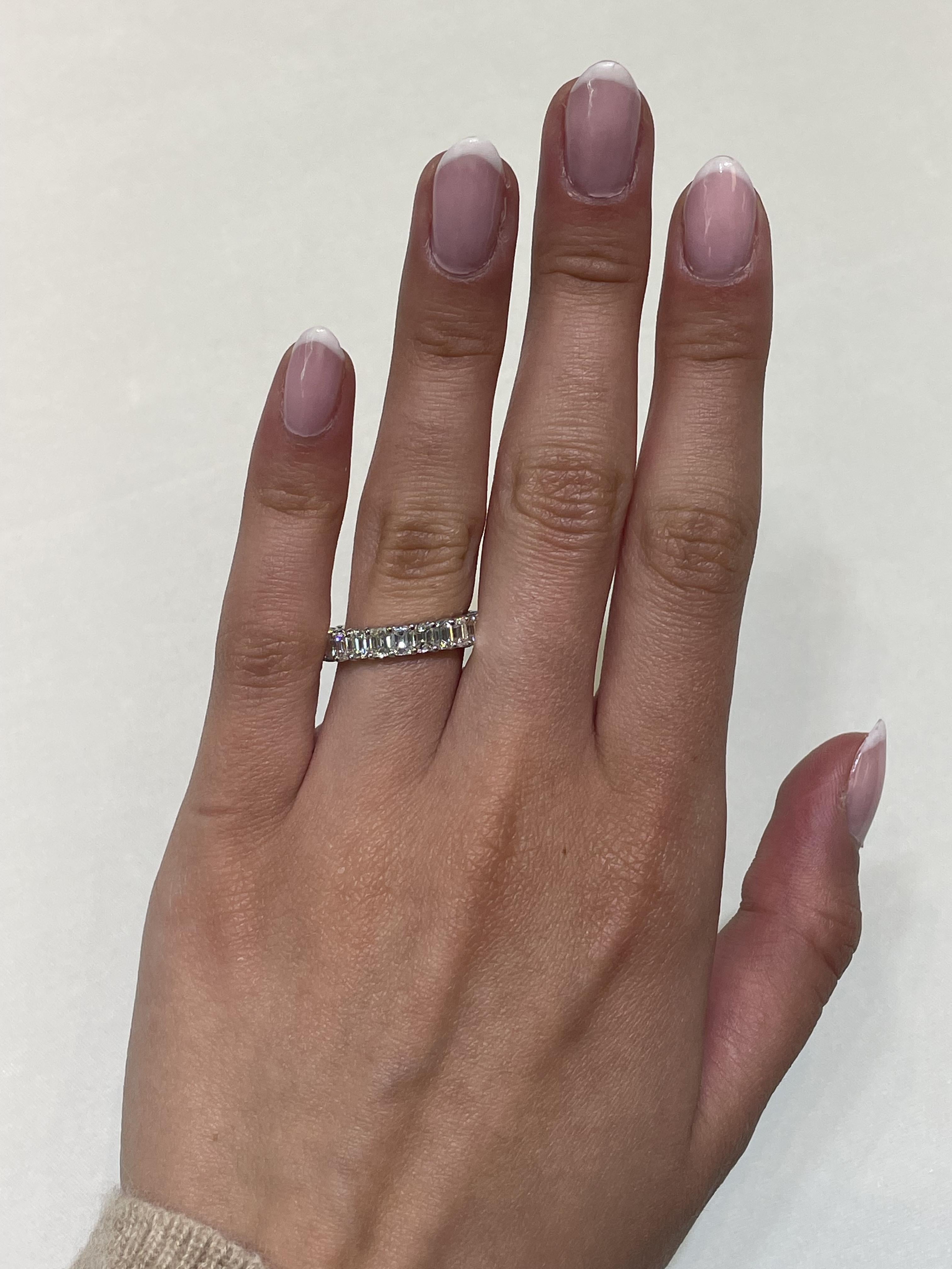 Stunning emerald cut diamond eternity band, by Alexander Beverly Hills.
24 emerald cut diamonds, 3.97 carats total. Approximately G/H color and VS1 clarity. 4 prong set in 18-karat white gold, 3.56 grams, size 6.
Accommodated with an up to date