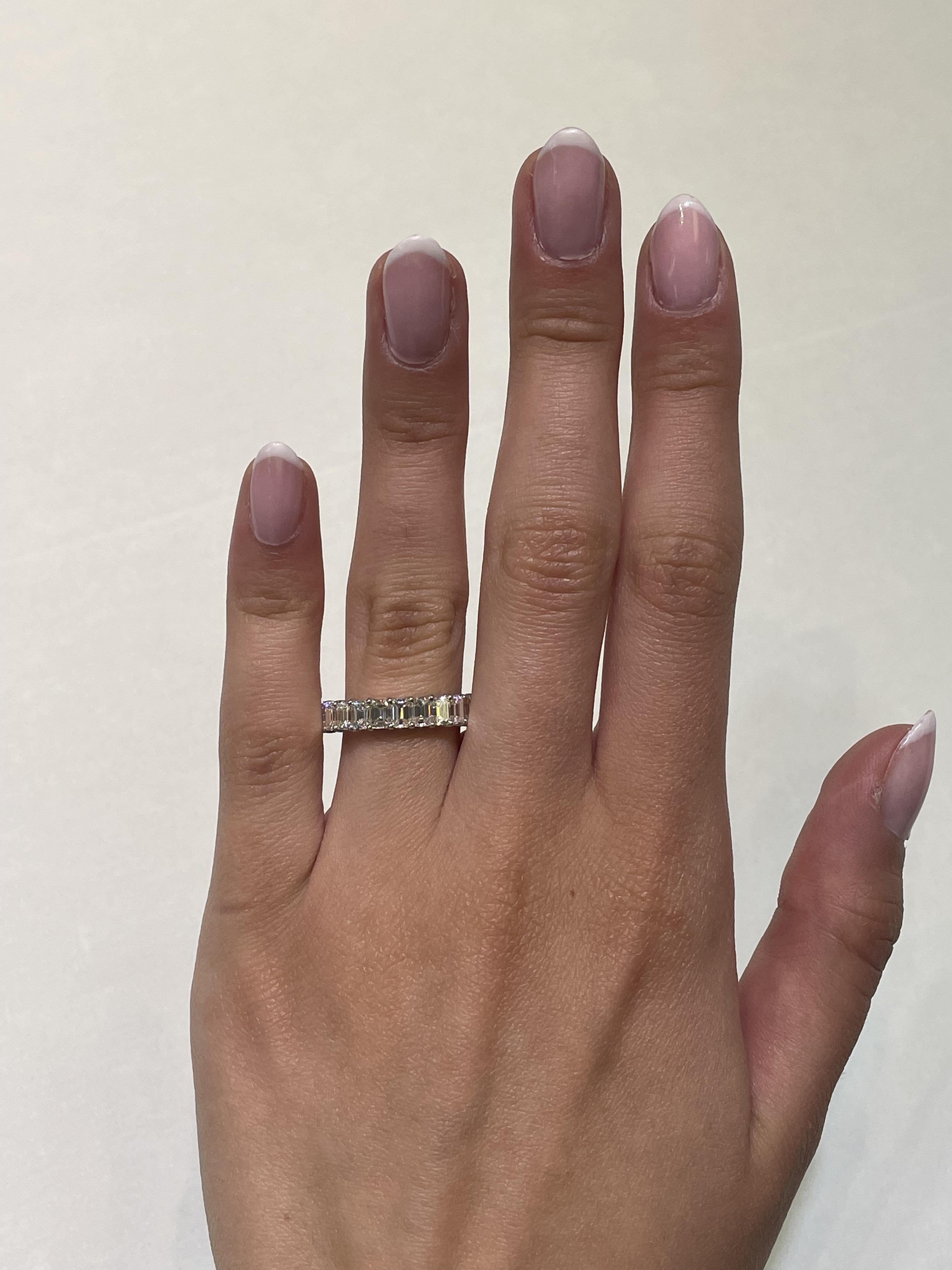 Stunning emerald cut diamond eternity band, by Alexander Beverly Hills.
24 emerald cut diamonds, 4.14 carats total. Approximately G/H color and VS1 clarity. 4 prong set in 18-karat white gold, 3.49 grams, size 6.
Accommodated with an up to date