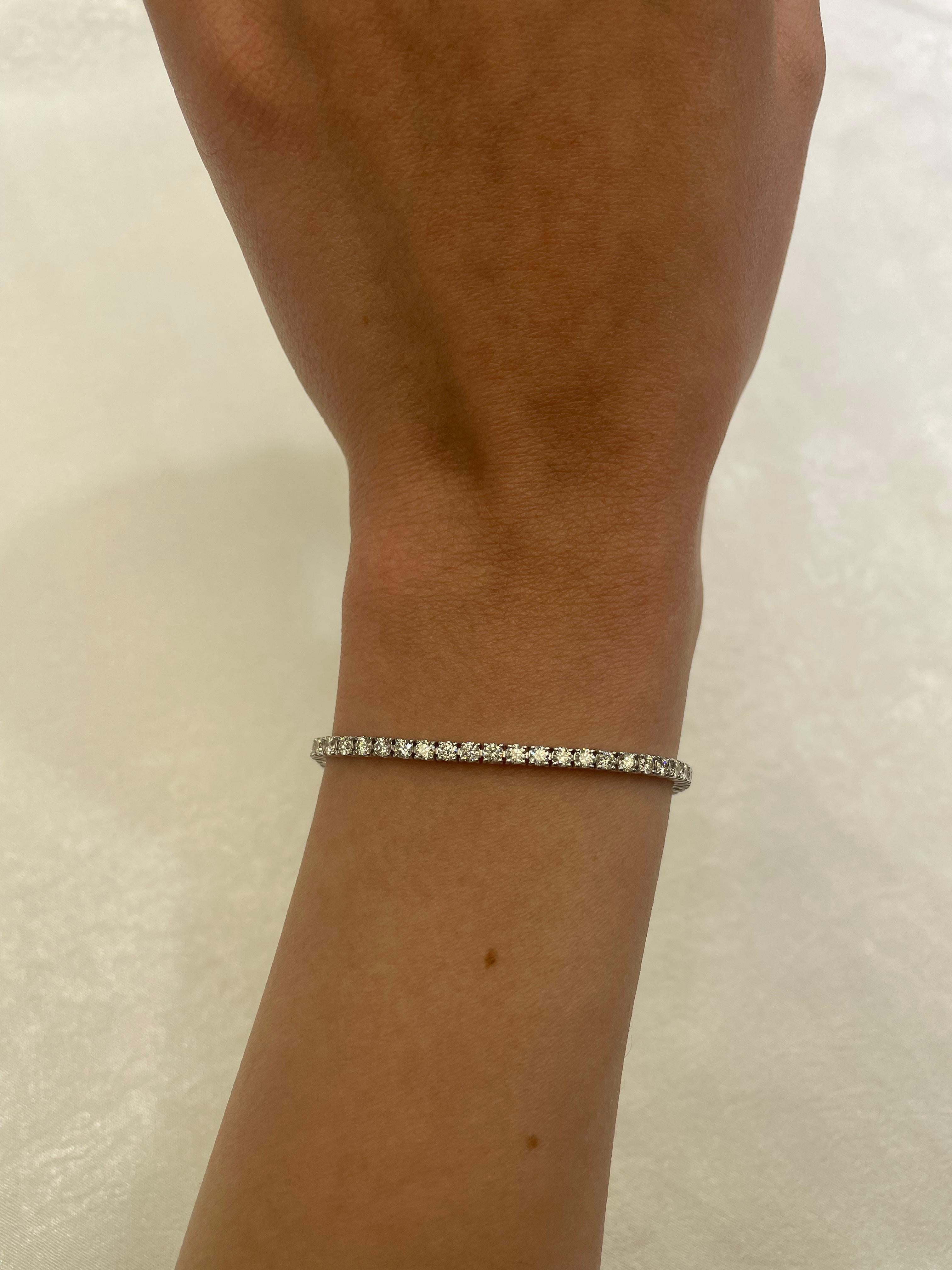 Exquisite and timeless diamonds tennis bracelet, by Alexander Beverly Hills.
65 round brilliant diamonds, 4.19 carats total. Approximately I color and VS1 clarity. Four prong set in 18k white gold, 8.47 grams, 7 inches.
Accommodated with an up to