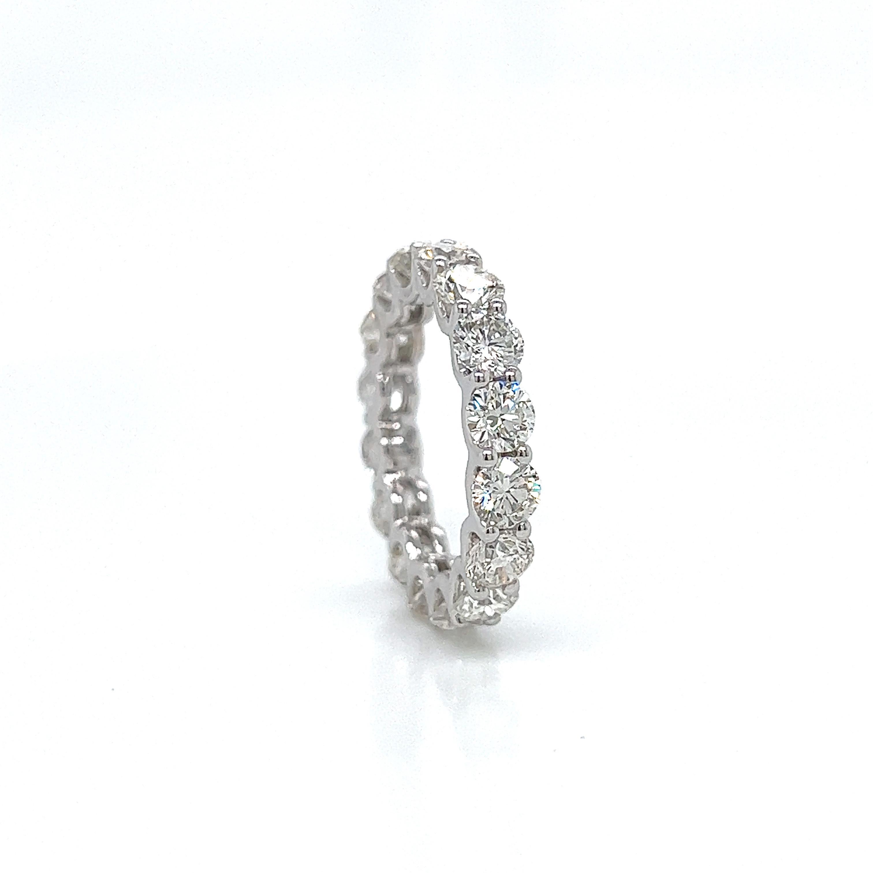 Timeless diamond eternity band. By Alexander Beverly Hills.
16 round brilliant diamonds, 4.33 carats. Approximately G color and VS1 clarity. U prong set in 18k white gold, 3.37 grams, size 5.
Accommodated with an up-to-date appraisal by a GIA G.G.
