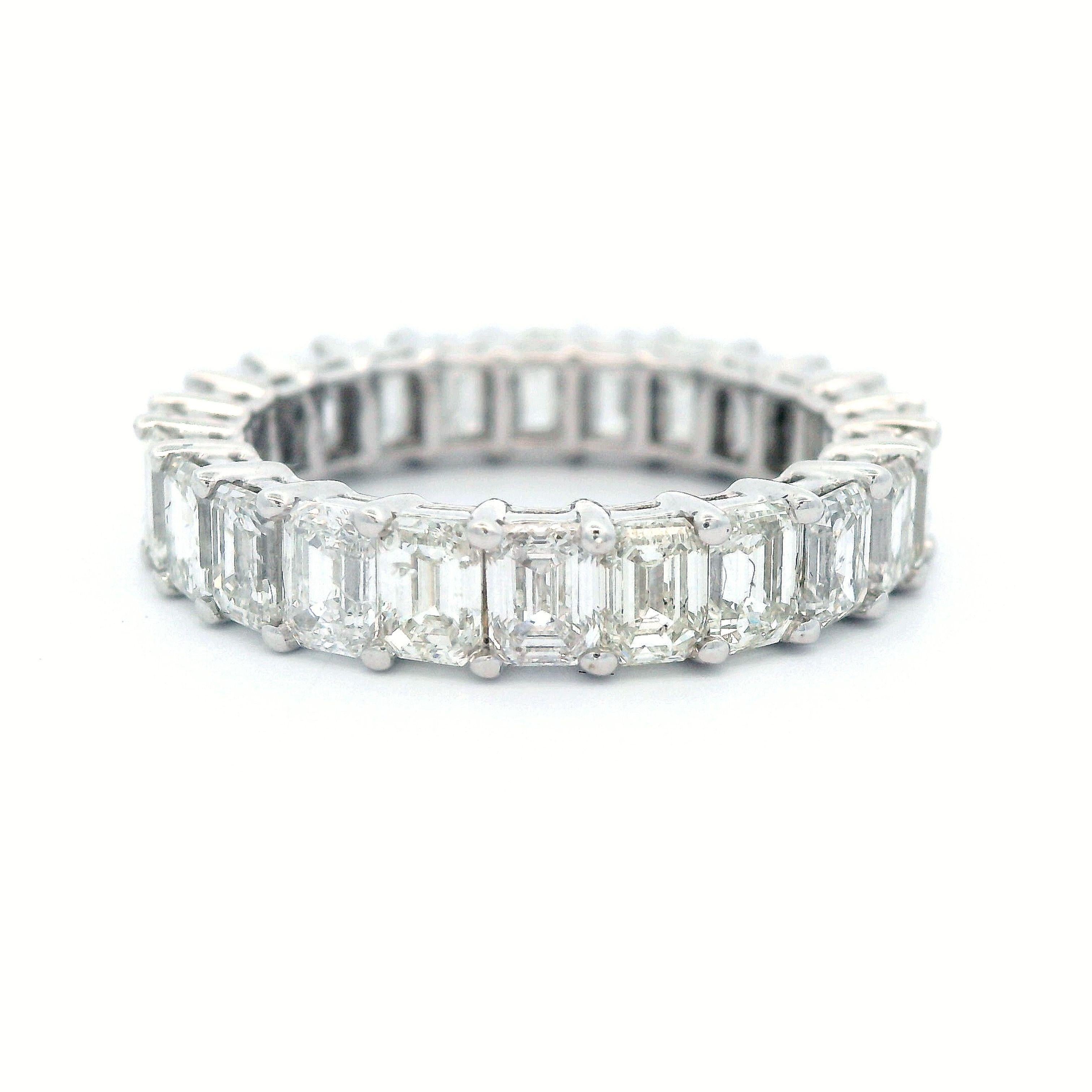 Stunning emerald cut diamond eternity band, by Alexander Beverly Hills.
24 emerald cut diamonds, 4.41 carats total. Approximately F/G color and SI clarity. 4 prong set in 18k white gold, 3.66 grams, size 5.5.
Accommodated with an up-to-date