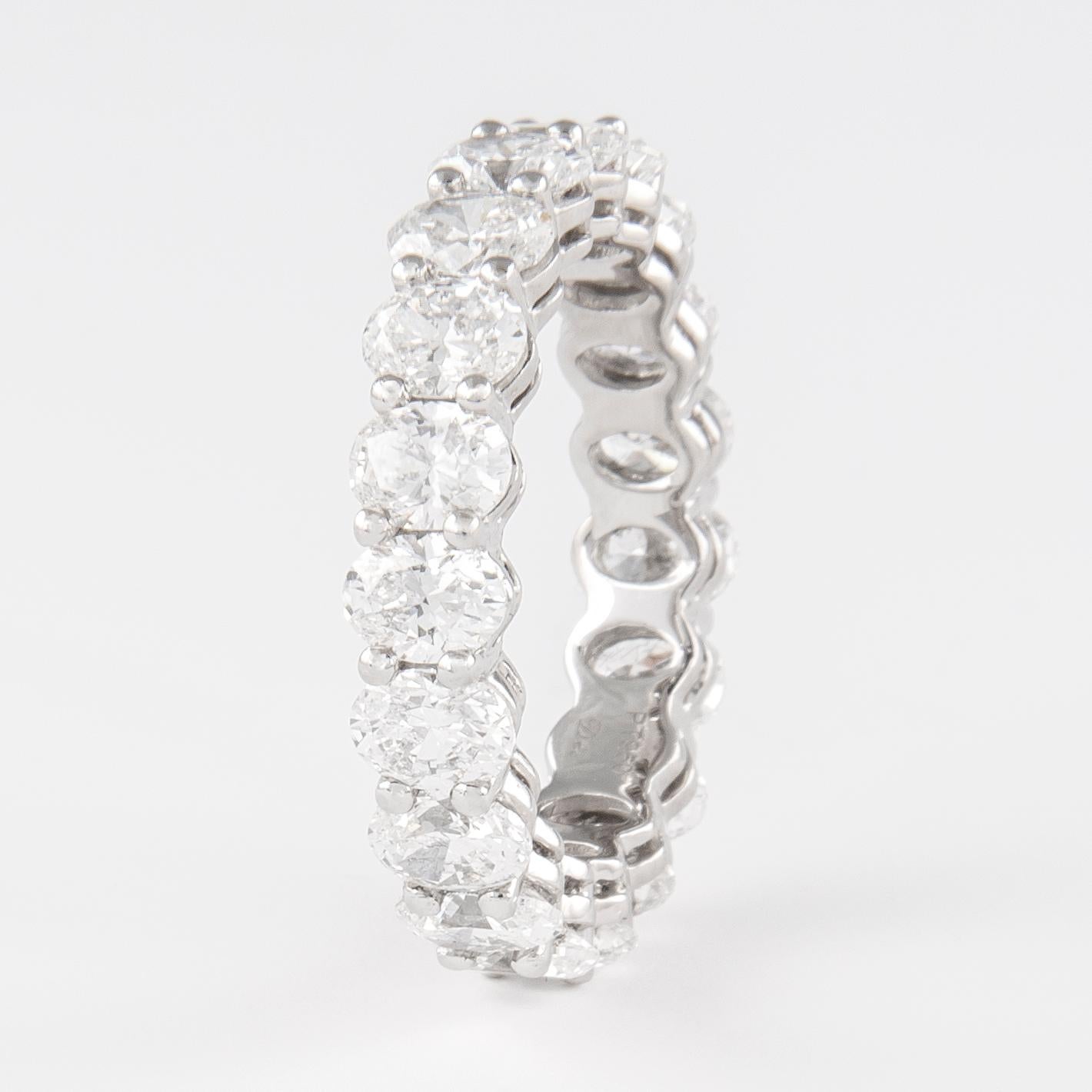 Stunning oval cut diamond eternity band, by Alexander Beverly Hills.
19 oval cut diamonds, 4.54 carats total. Approximately F/G color and SI clarity. Set in 18k white gold, 4.58 grams, size 6.5. 
Accommodated with an up-to-date appraisal by a GIA