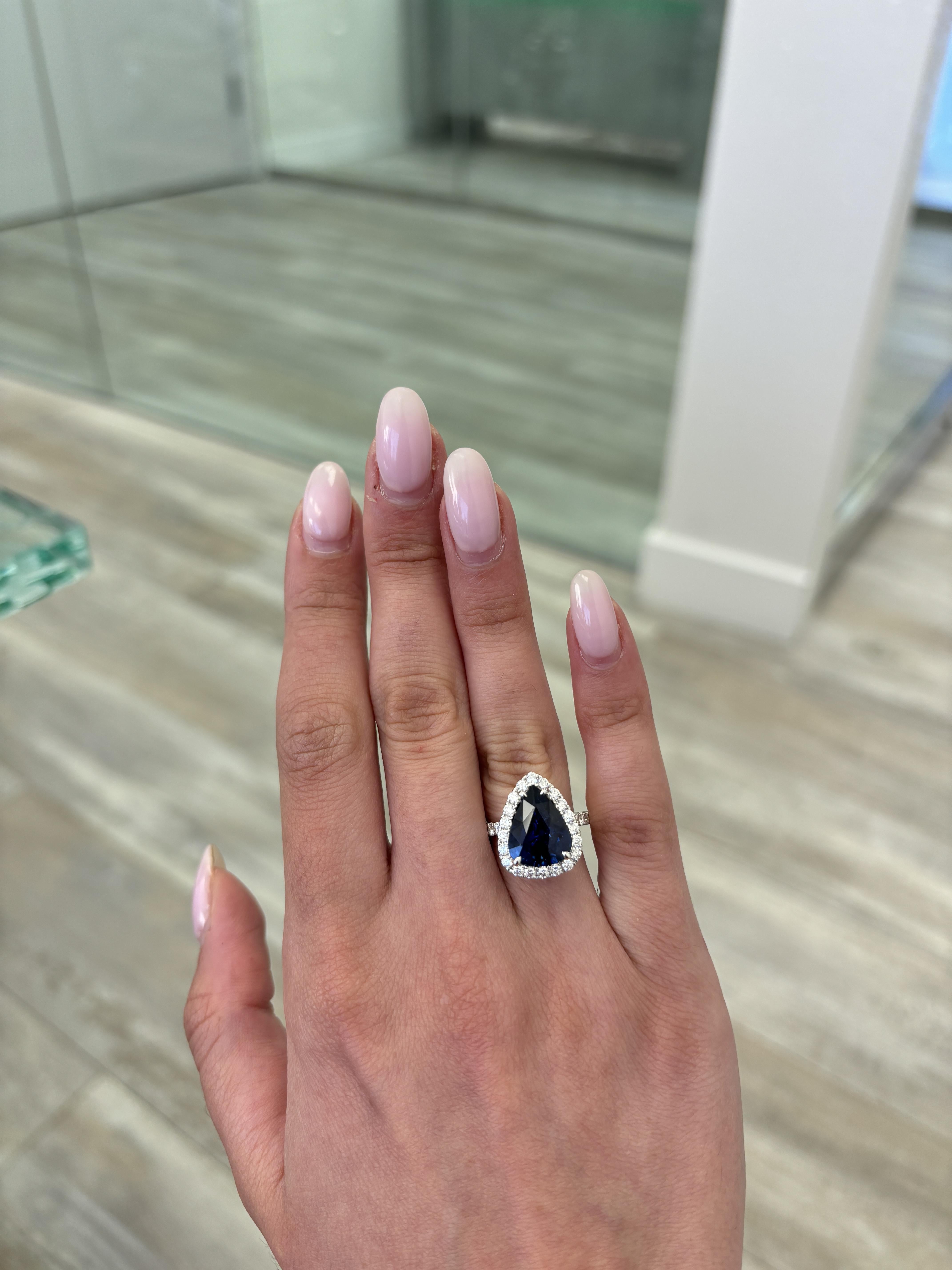 Stunning navy blue sapphire ring with diamond halo, GIA certified, by Alexander Beverly Hills. 
5.46 carats total gemstone weight.
4.56 carat pear sapphire, heat, GIA certified. Complimented with 32 round brilliant diamonds, 0.90 carats.