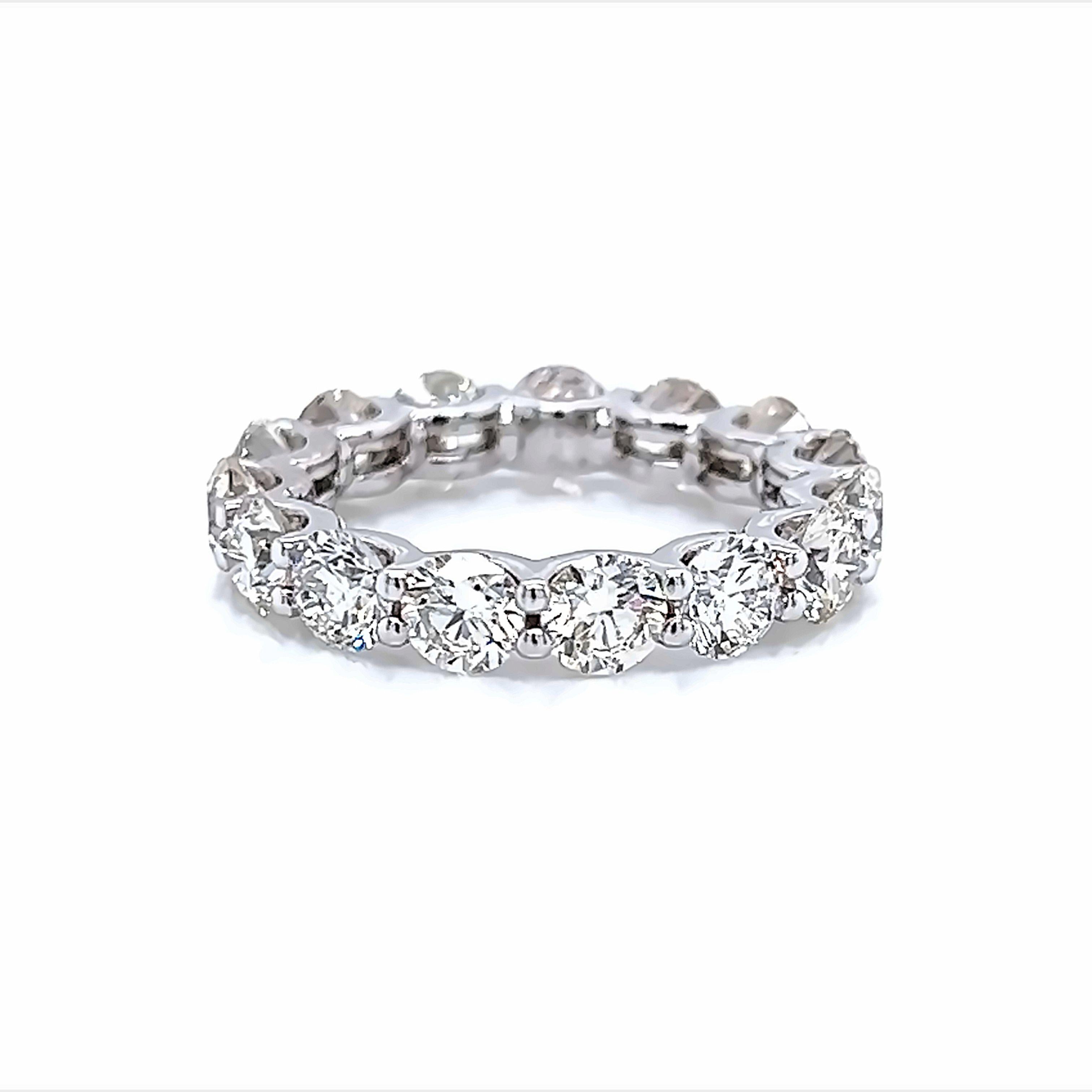 Timeless diamond eternity band. By Alexander Beverly Hills.
15 round brilliant diamonds, 4.59 carats. Approximately G color and VS1 clarity. U prong set in 18k white gold, 4.96 grams, size 5.5.
Accommodated with an up-to-date appraisal by a GIA G.G.