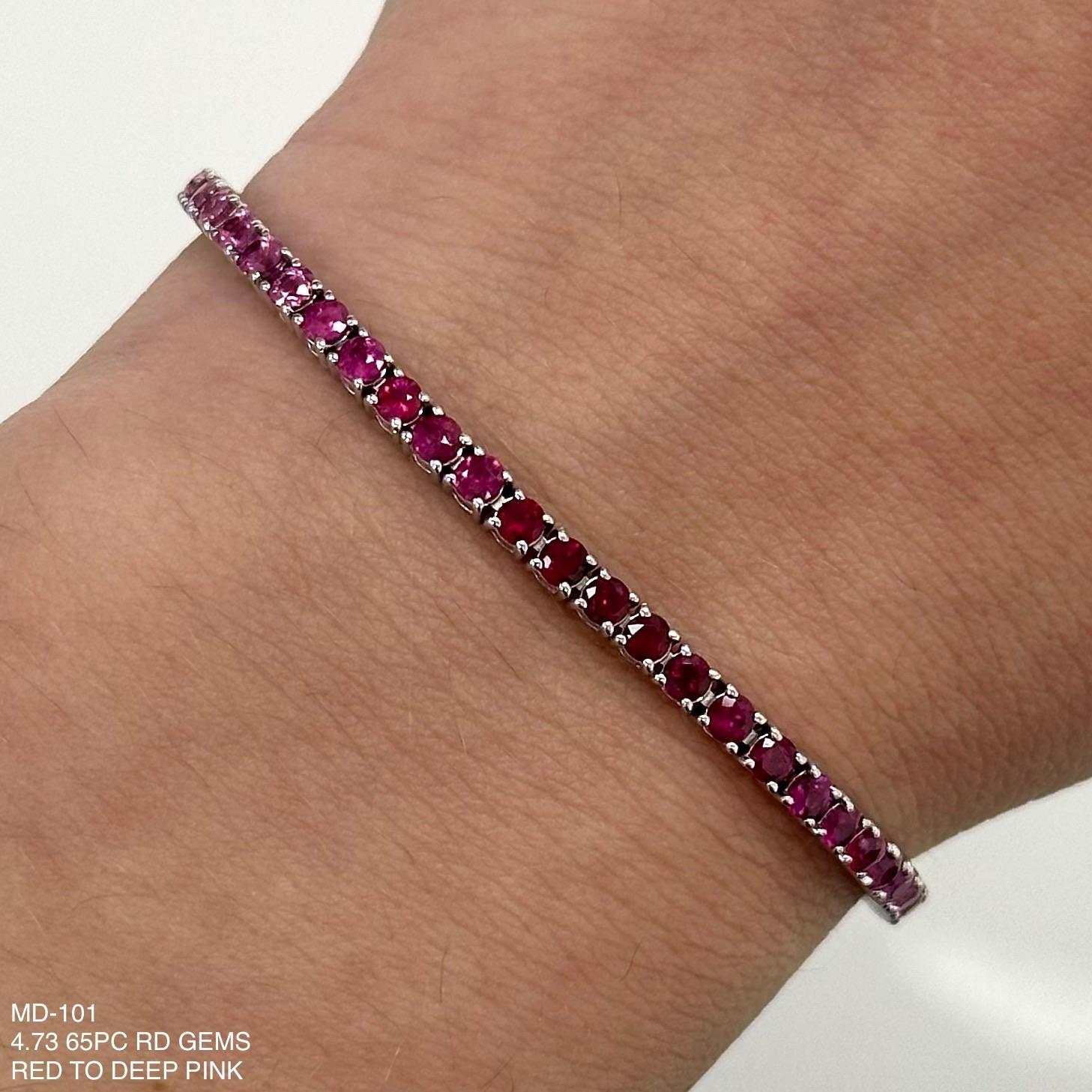 Exquisite and perfectly blended red to pink rubies and sapphires tennis bracelet, by Alexander Beverly Hills.
65 round rubies and pink sapphires, 4.72 carats total. Four prong set in 18-karat white gold, 8.33 grams, 7 inches.
Accommodated with an