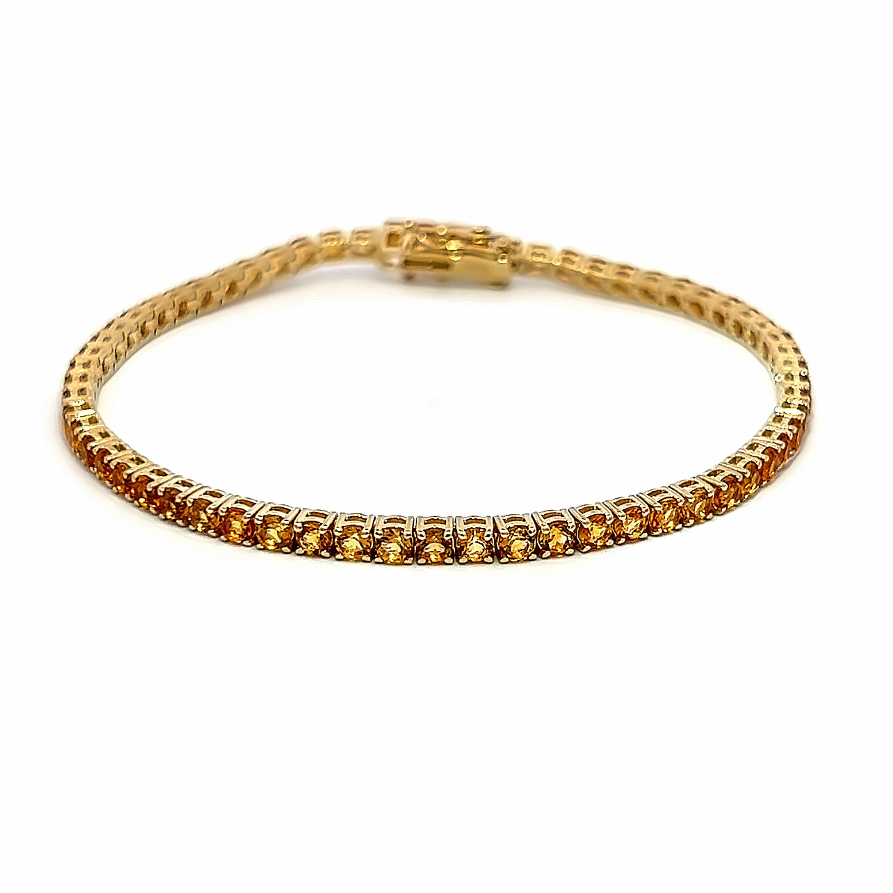 Modern citrine tennis bracelet, by Alexander Beverly Hills.
62 round citrines, 5.22 carats total. Four prong set in 14-karat yellow gold, 8.59 grams, 7 inches.
Accommodated with an up-to-date digital appraisal by a GIA G.G. once purchased, upon