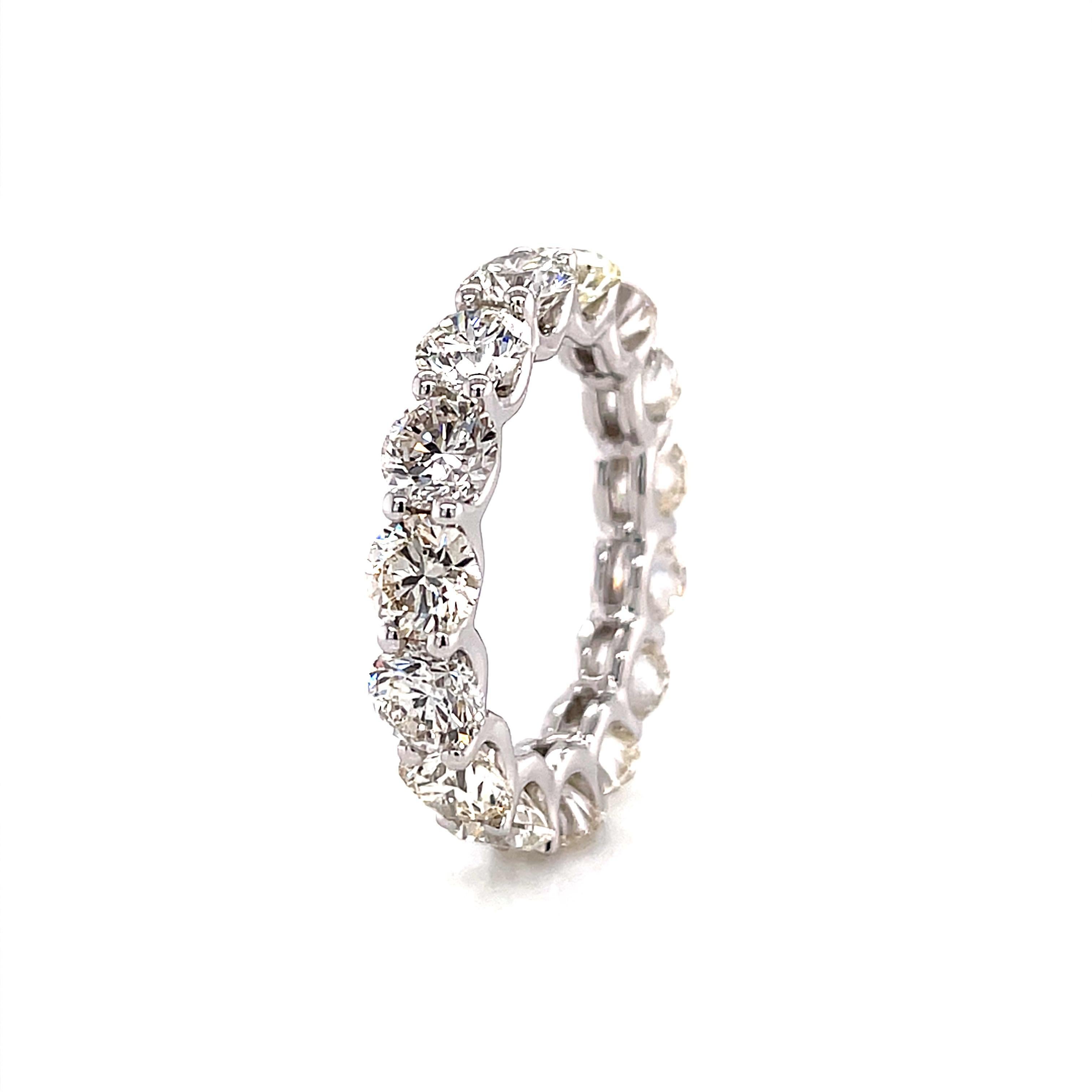 Timeless diamond eternity band. By Alexander Beverly Hills.
15 round brilliant diamonds, 5.68 carats. Approximately G color and VS1 clarity. U prong set in 18k white gold, 4.39 grams, size 6.25.
Accommodated with an up-to-date appraisal by a GIA