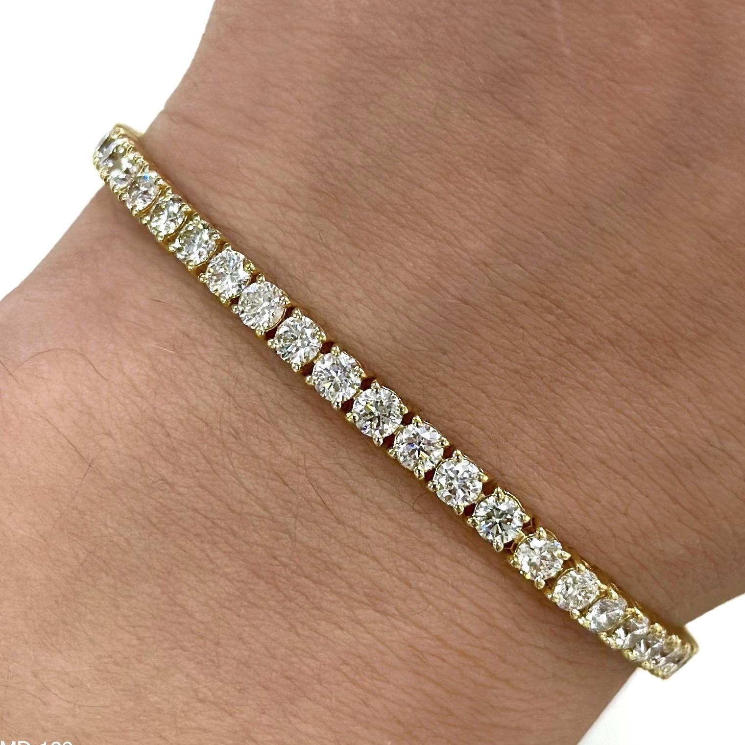 Beautiful and classic diamond tennis bracelet. Created by Alexander Beverly Hills.
53 round brilliant diamonds, 6.07 carats. Approximately I color and VS1 clarity. 18-karat yellow gold, 8.64 grams, 7in.
Accommodated with an up to date digital