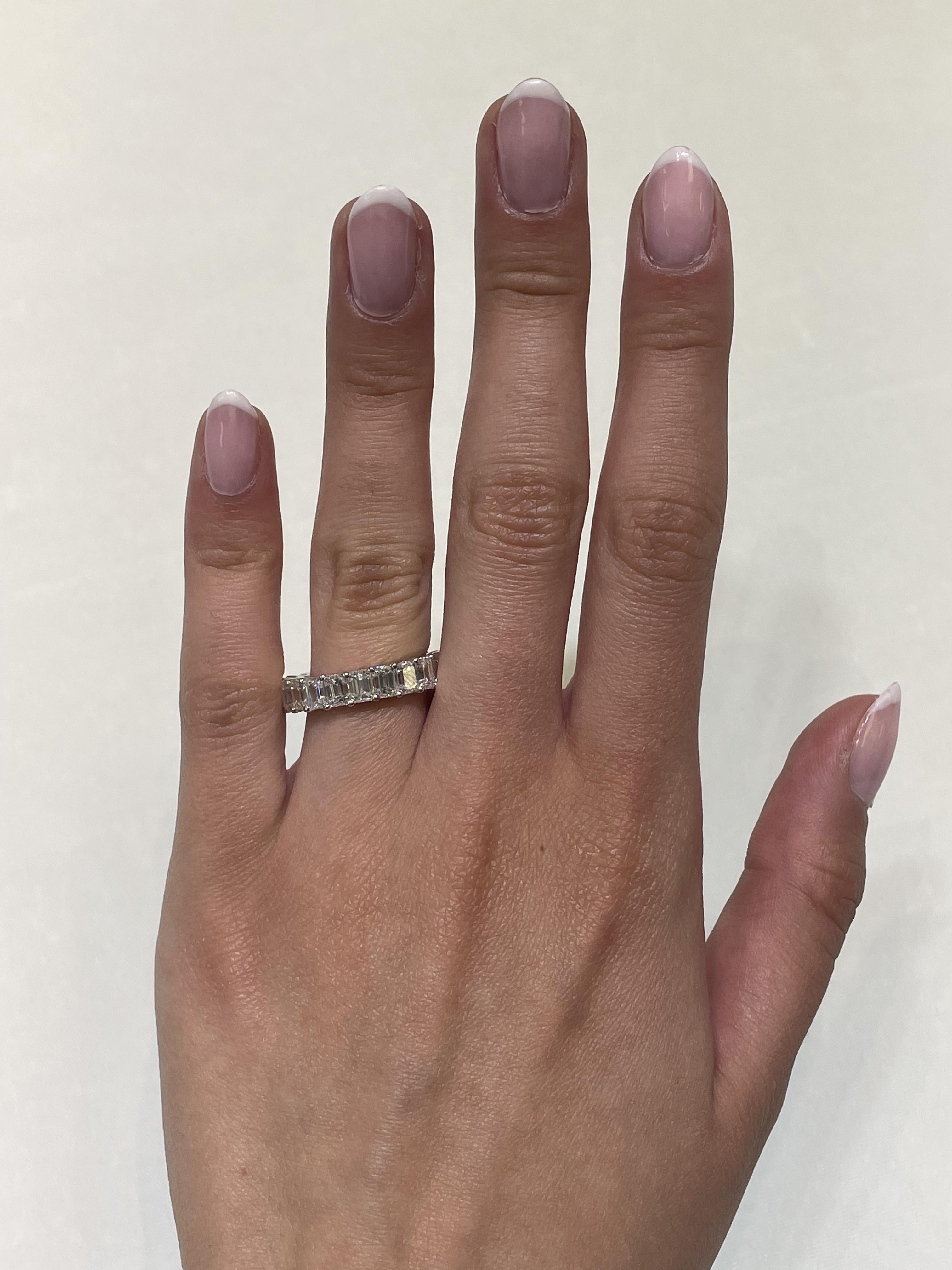 Stunning emerald cut diamond eternity band, by Alexander Beverly Hills.
21 emerald cut diamonds, 6.43 carats total. Approximately G color and VS1 clarity. 4 prong set in 18-karat white gold, 3.23 grams, size 5.75.
Accommodated with an up to date